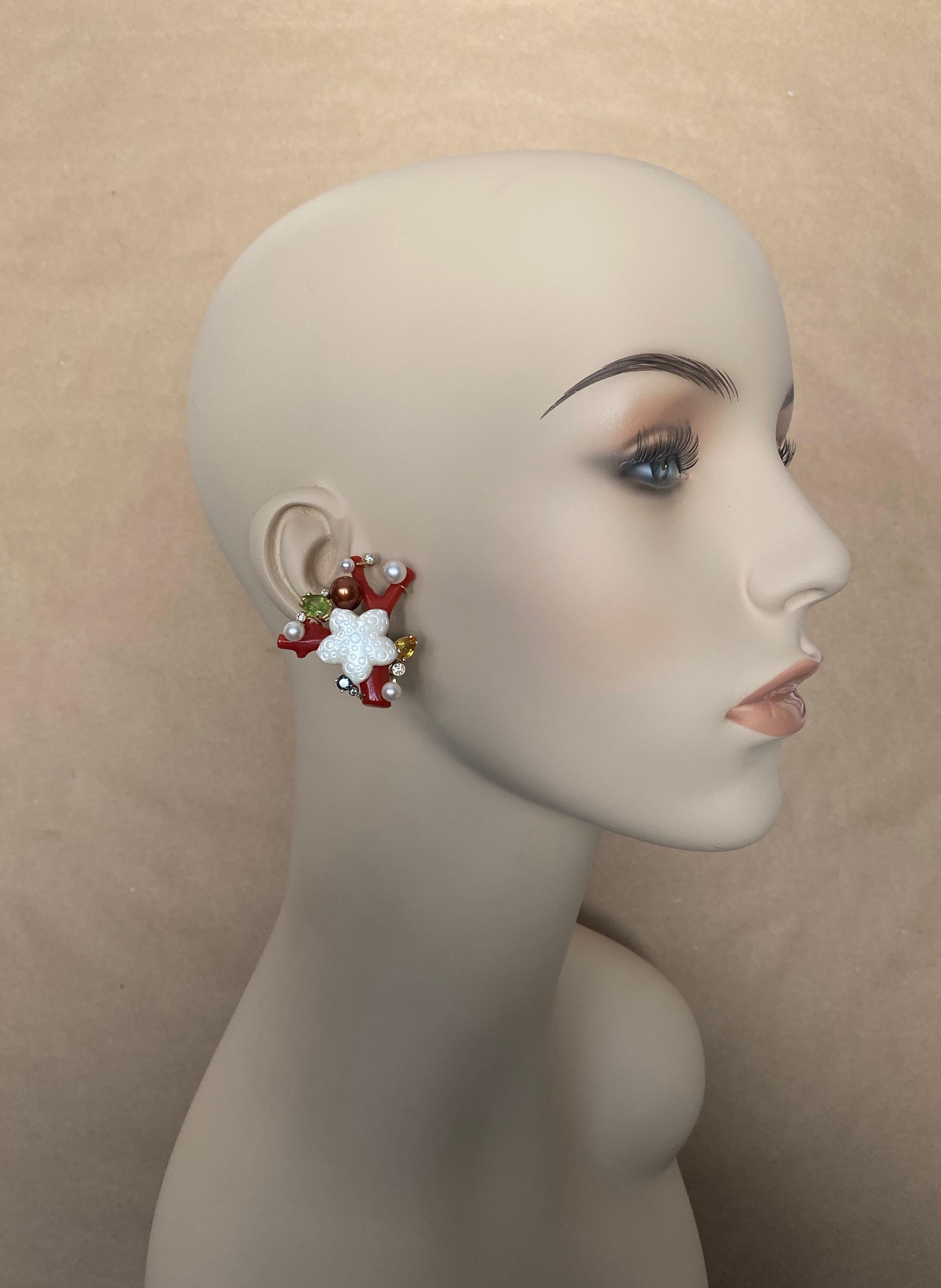 Mediterranean red branch coral forms the foundations for these one-of-a-kind Sea Life earrings.  The red coral is polished to a glass-like finish.  Featured in each composition is a carved mother-of-pearl starfish.  Further embellishing the earrings