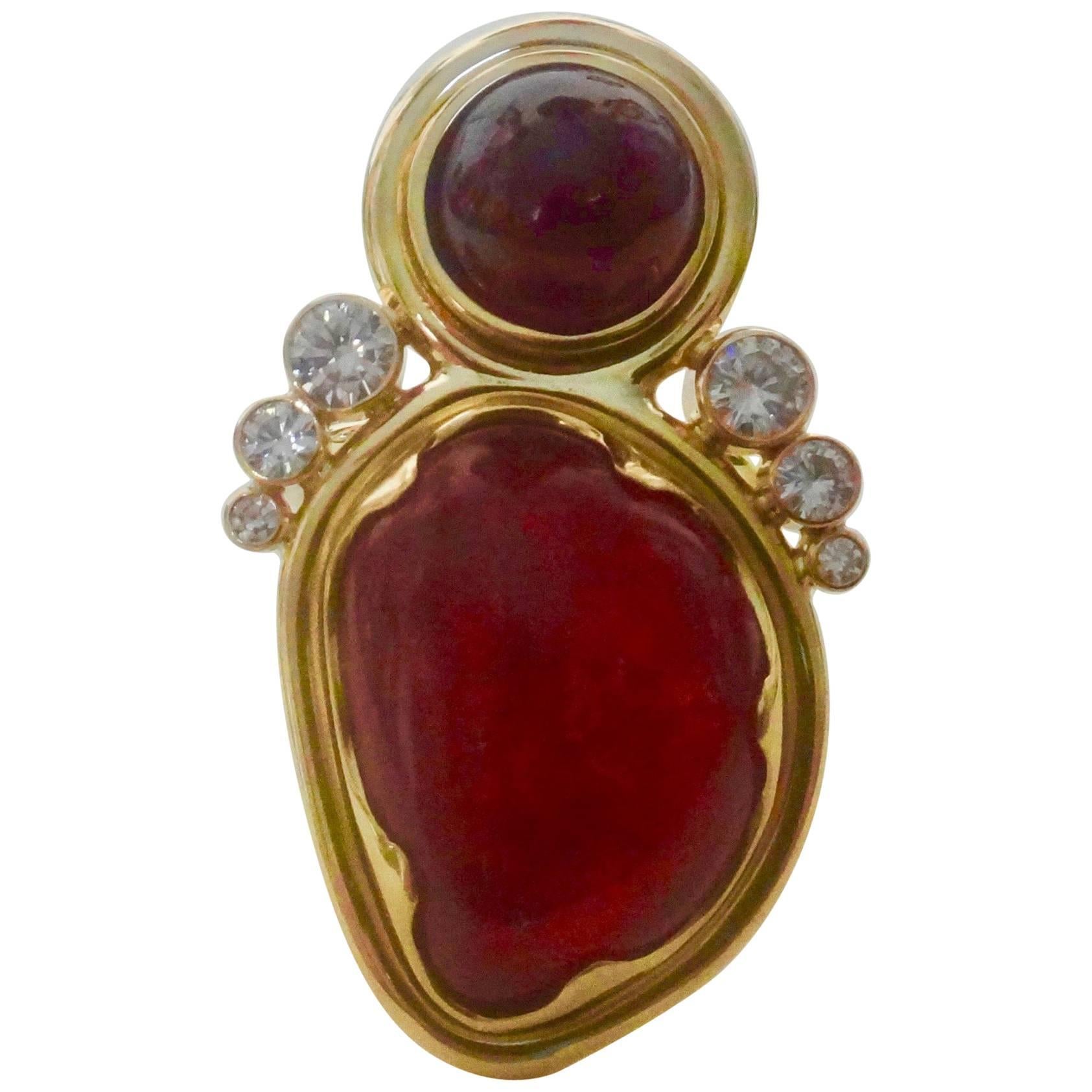 A gem quality cabochon Rhondonite (origin: Sweden) is featured in this dramatic cocktail ring.  The jewel is an intense pink color with some inclusions typically found in cabochon cut gems.  The rhondonite is complimented by a deep red, round cut,