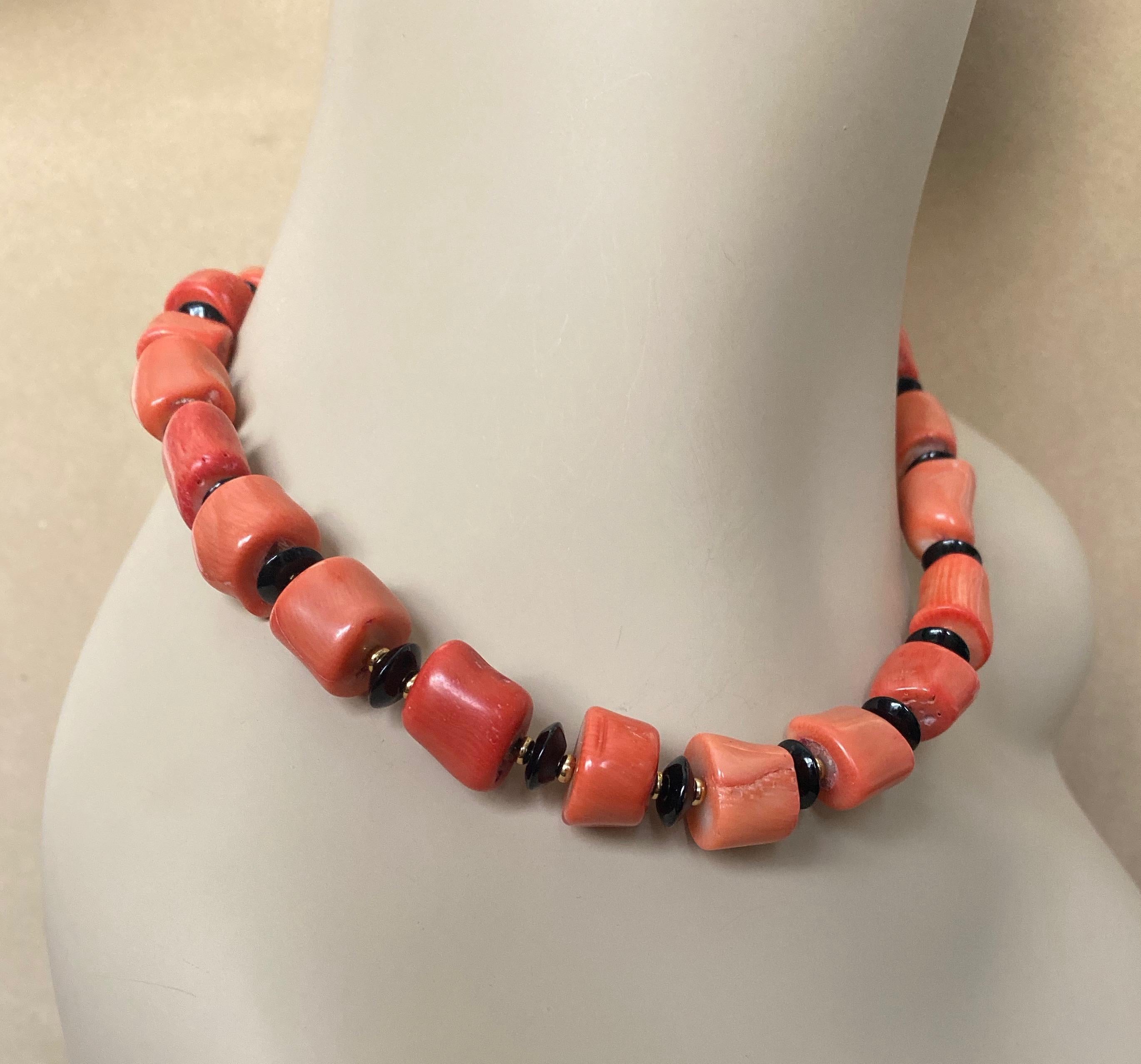 A huge branch of salmon colored coral has been sliced into nuggets to create the beads in this stylish necklace perfect this summer or for a tropical vacation.  The beads are highly polished and are irregular in shape-typical of branch coral.  The