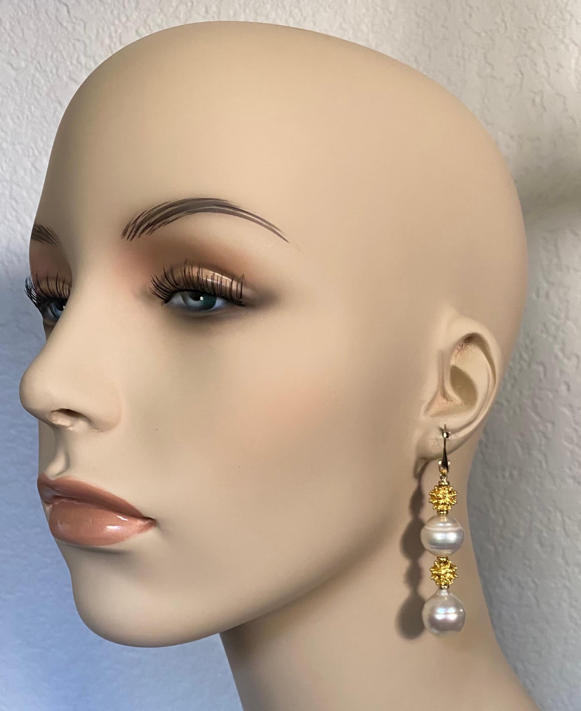 Baroque South Seas pearls are paired with granulated beads in these daring dangle earrings.  The pearls are bright white with irregularities typically found in baroque pearls of all types.  The pearls are complimented by 10mm granulated vermeil