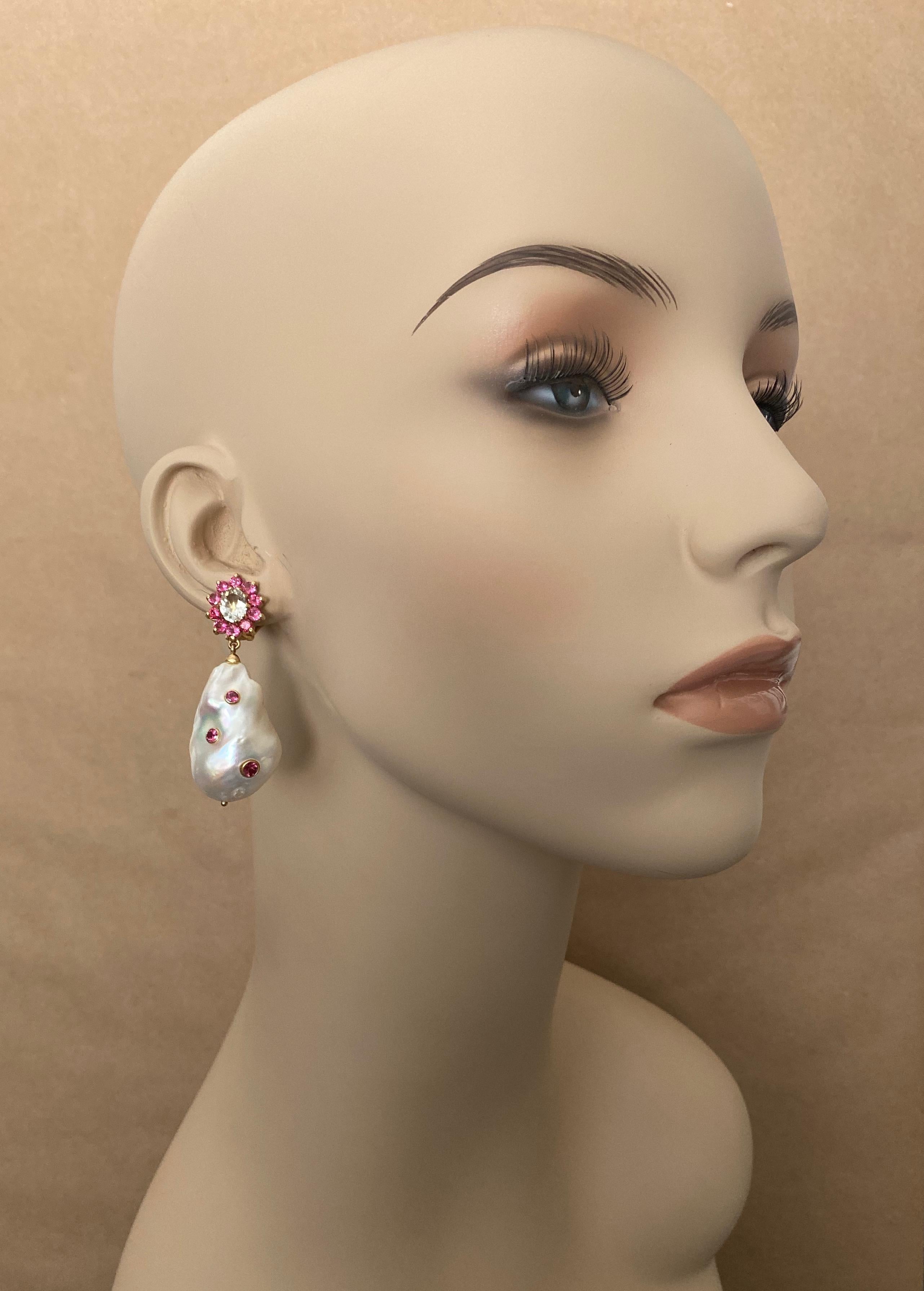 A huge pair of pale pink and white baroque pearls are featured in these impressive dangle earrings.  The white pearl measure 30mm while the pink pearl measures 32mm.  Both are elongated baroque shapes, are blemish free and possess brilliant luster. 