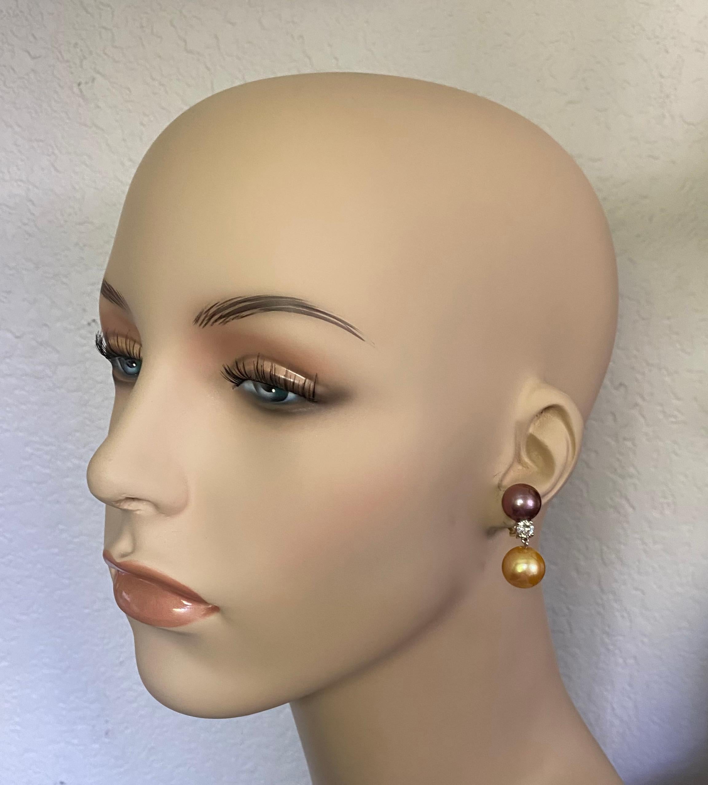 Tahitian and South Seas pearls combine to create these sophisticated dangle earrings.  The pearls measure 12mm and 14mm respectfully and come in complimentary shades of pink, cream, gold and gray.  The pearls are all gem quality and possess a