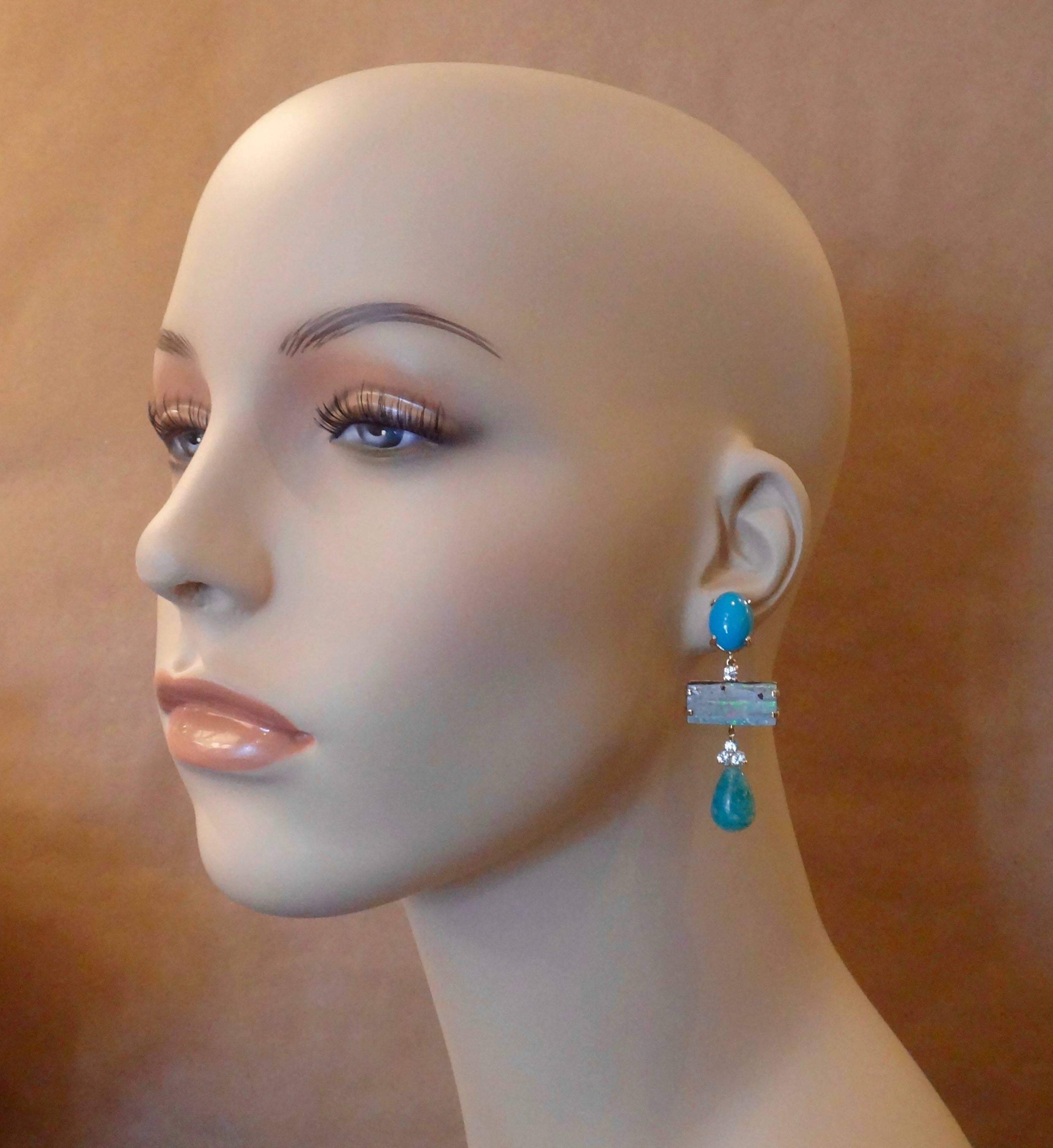 Sleeping Beauty turquoise forms the anchors for these monochromatic dangle earrings.  Complimenting the turquoise are brilliant cut blue zircons (Myanmar), Boulder Opals (Boulder opal is one of the most valuable varieties of opal, second only to