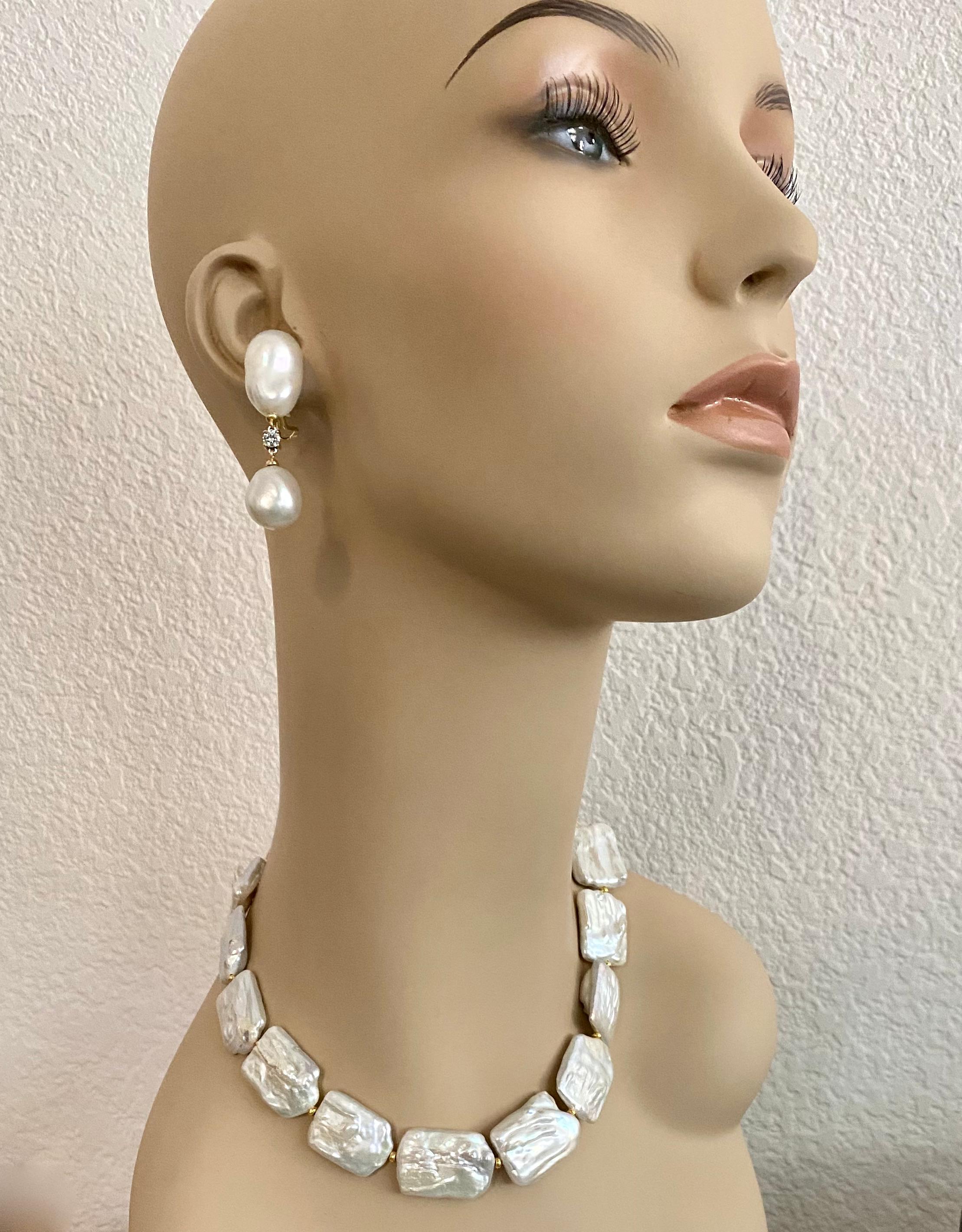 Baroque tile pearls are featured in this classic necklace.  The cultured pearls (origin: China) measure approximately 1 inch square.  They are bright white in color, possess iridescent luster and are typically baroque in surface.  The pearls are