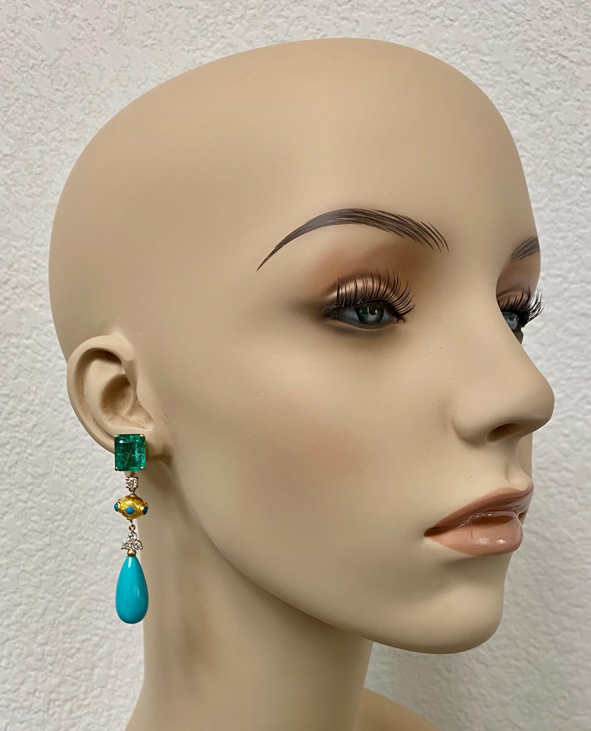 Emerald and turquoise are paired in this outstanding pair of dangle earrings.  The emerald cut emeralds (origin: Zambia) are lively and bright 