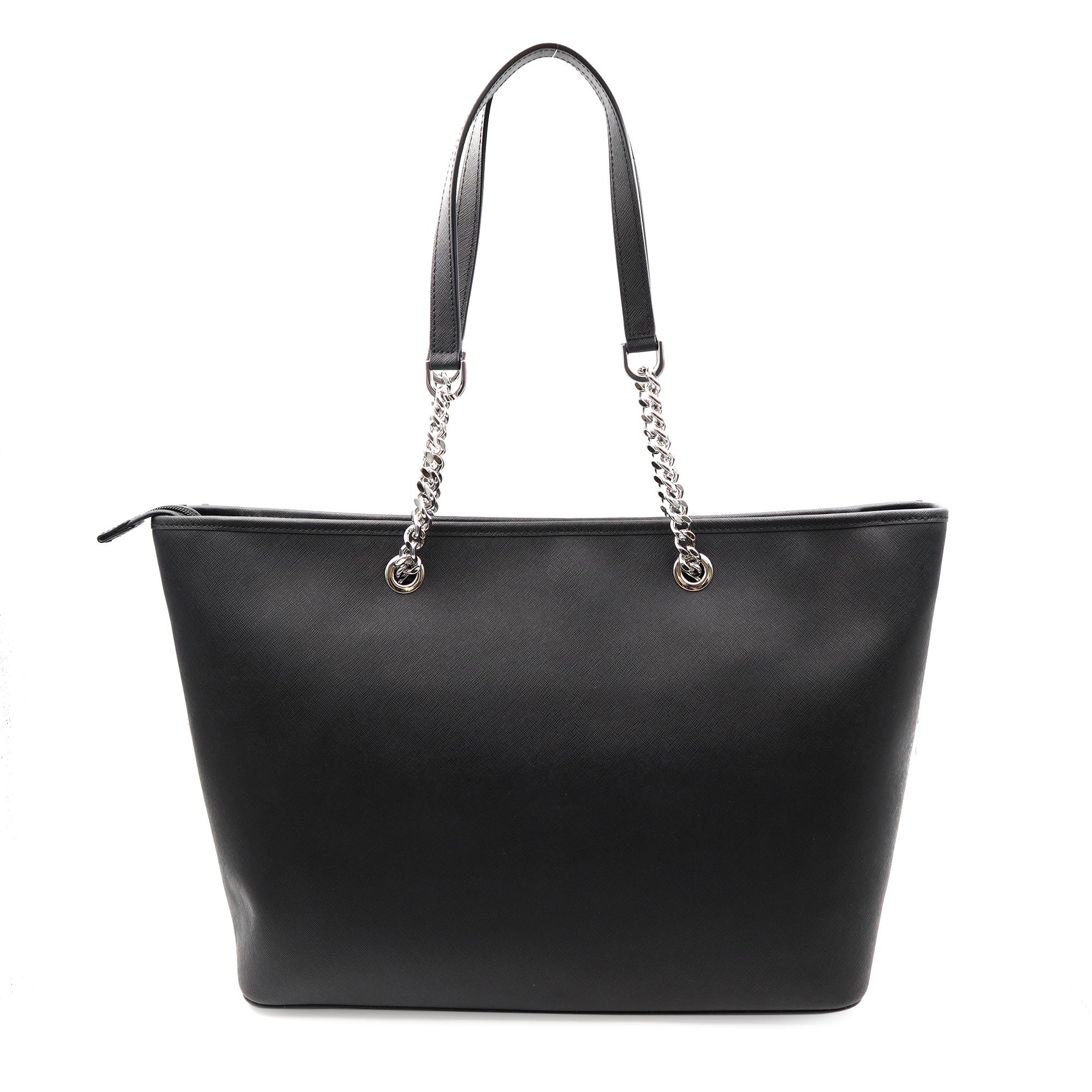 A Michael Kors Jet Set tote crafted in saffiano leather with silver-tone hardware and a fully lined interior. This Michael Kors Jet Set tote features two main zip pockets, a center zip pocket and interior wall pockets; two chain leather handles with