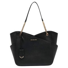 Michael Kors Bolso grande de piel negro con cadena Jet Set