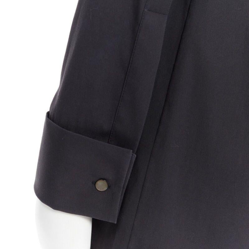 MICHAEL KORS black peak spread collar folded cuffs patch pocket long shirt US0
Reference: LNKO/A01148
Brand: Michael Kors
Material: Cotton
Color: Black
Pattern: Solid
Closure: Button
Extra Details: Elongated shirt. Spread collar. Folded cuffs. Patch