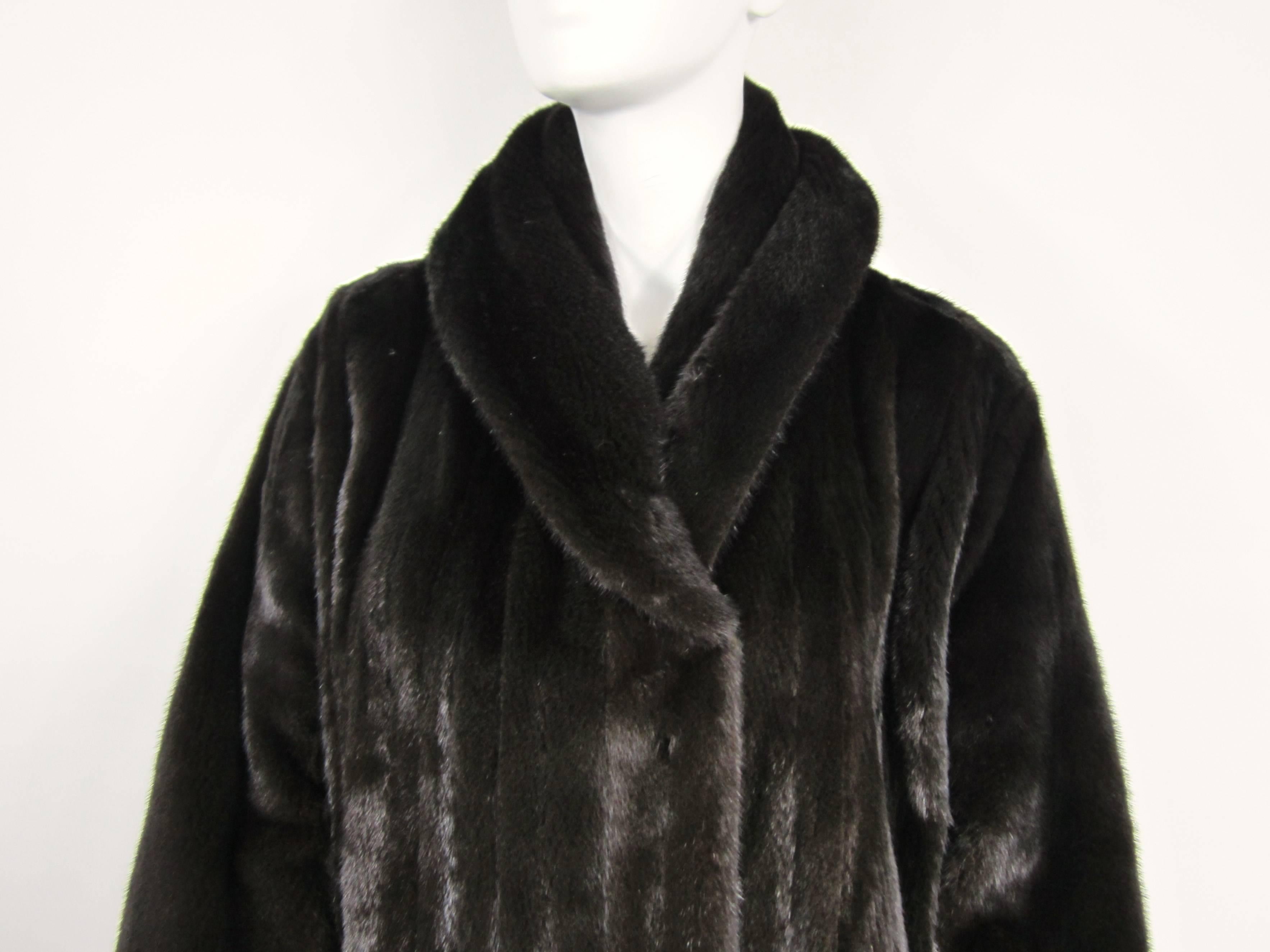 Stunning Michael Kors Ranch Mink, velvet lined slit pockets with a Large collar. 2 pockets. Mink is Soft and supple Mink Retails New $15,000.00 Measuring approximately 48 in Bust, 48 in Waist, 48.5 inches long, 9.5 in collar unfolded. Will fit a