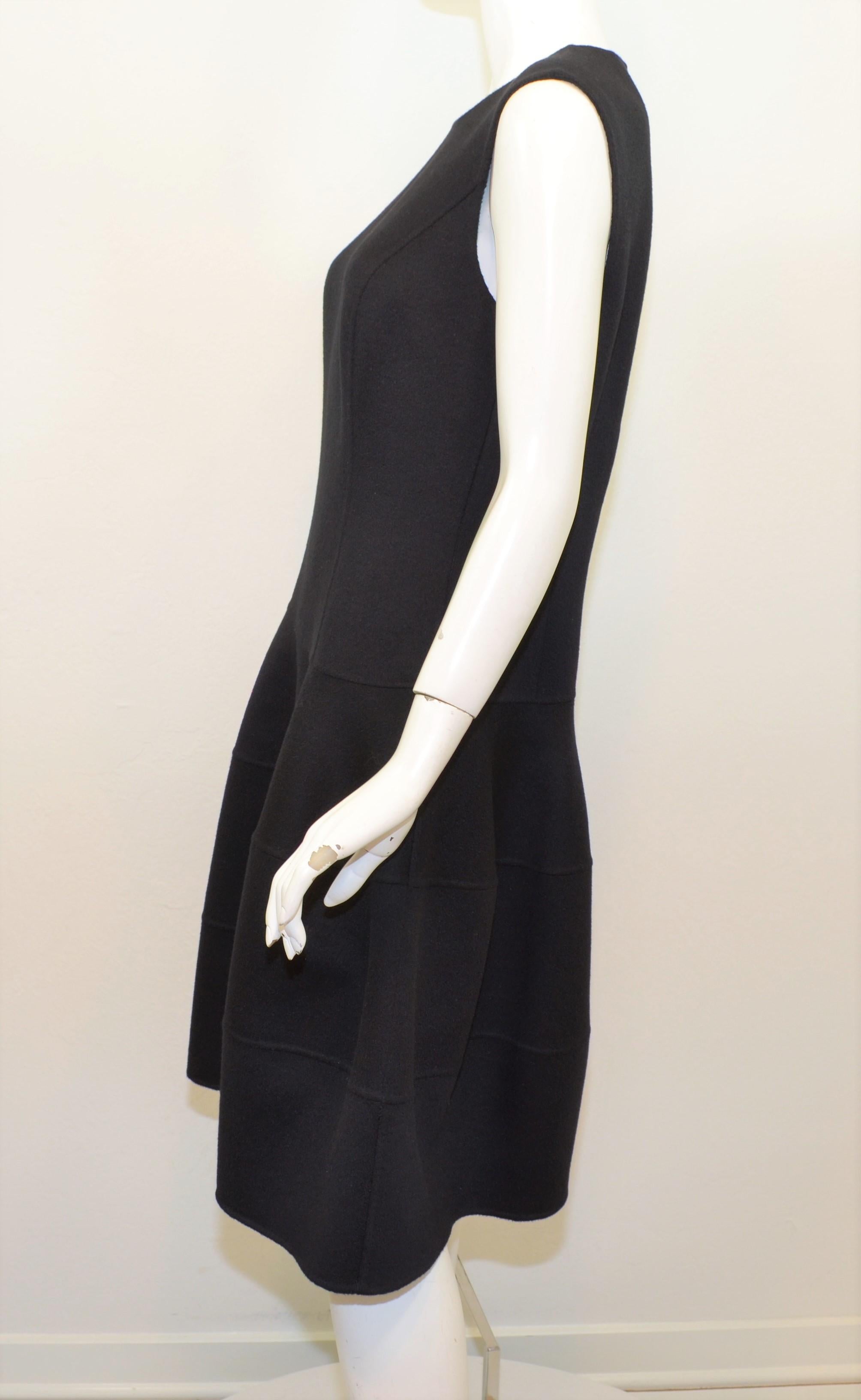 Michael Kors dress is featured in black, composed with a soft wool and angora blend fabric, a drop waist design and a side zipper fastening. Dress is new with tags and is labeled a size 10.

Measurements:
Bust 37''
Waist 32''
Hips 44''
Length 41''