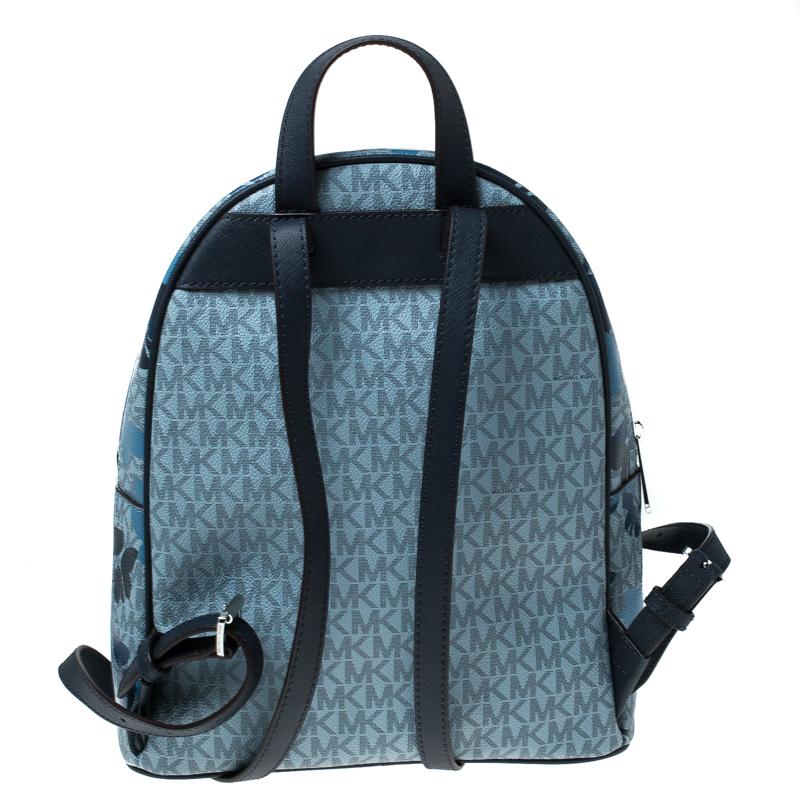 This Abbey backpack from Michael Kors is a functional piece ideal for people with an on-the-go lifestyle. Stylish and sporty, the bag is crafted with monogram printed canvas and detailed with leather trims and butterfly print on the front. It