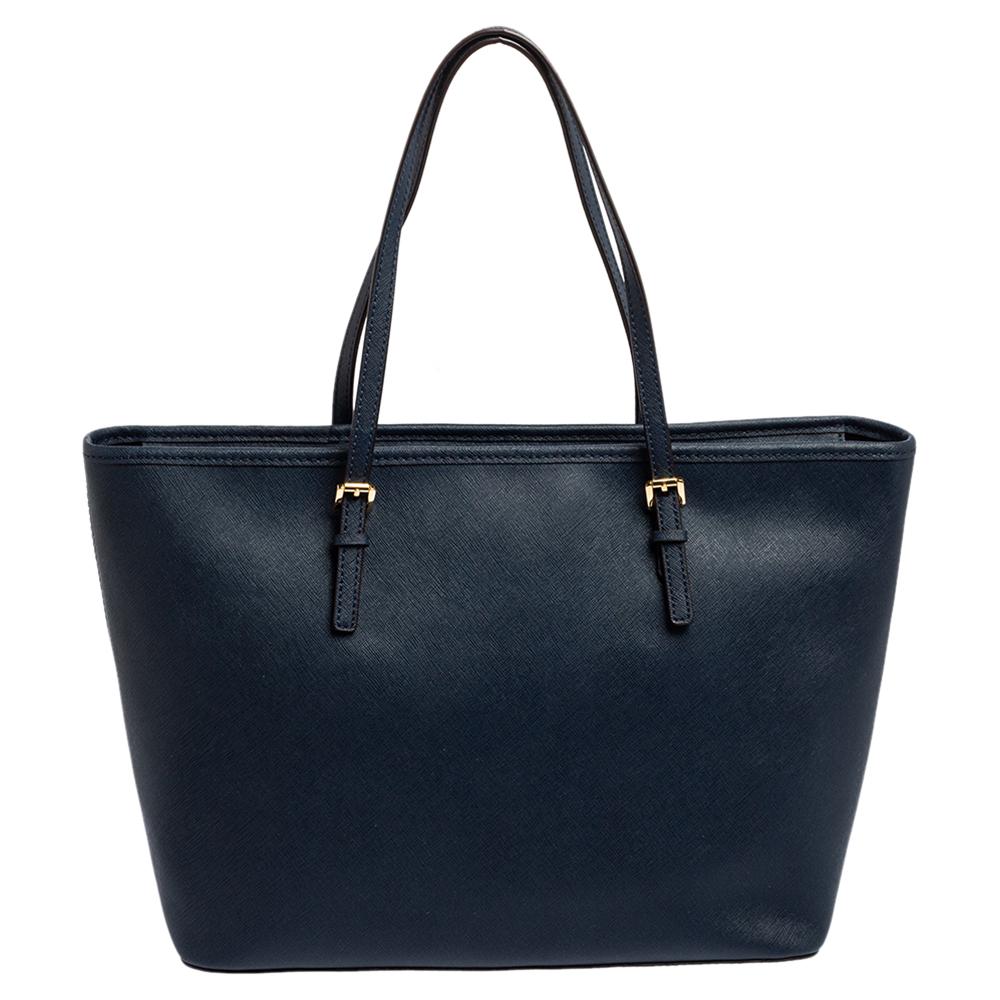 Timelessly elegant and stylish, Michael Kors' collections capture the effortless, nonchalant finesse of the modern woman. Crafted from Saffiano leather in a blue hue, this chic Jet Set tote features a spacious interior with a top zip fastening. The