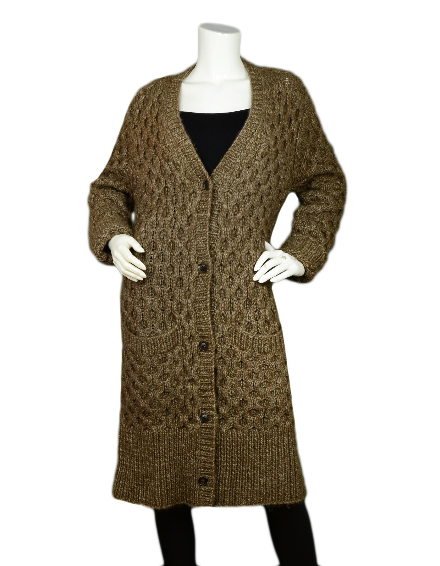 Michael Kors Brown Alpaca Wool Extra Long Knit Sweater Coat sz S

Made In: China with Italian Materials
Color: Brown
Materials: 25% Alpaca, 45% Wool, 30% Acrylic  
Lining: 25% Alpaca, 45% Wool, 30% Acrylic  
Opening/Closure: Front buttons
Overall
