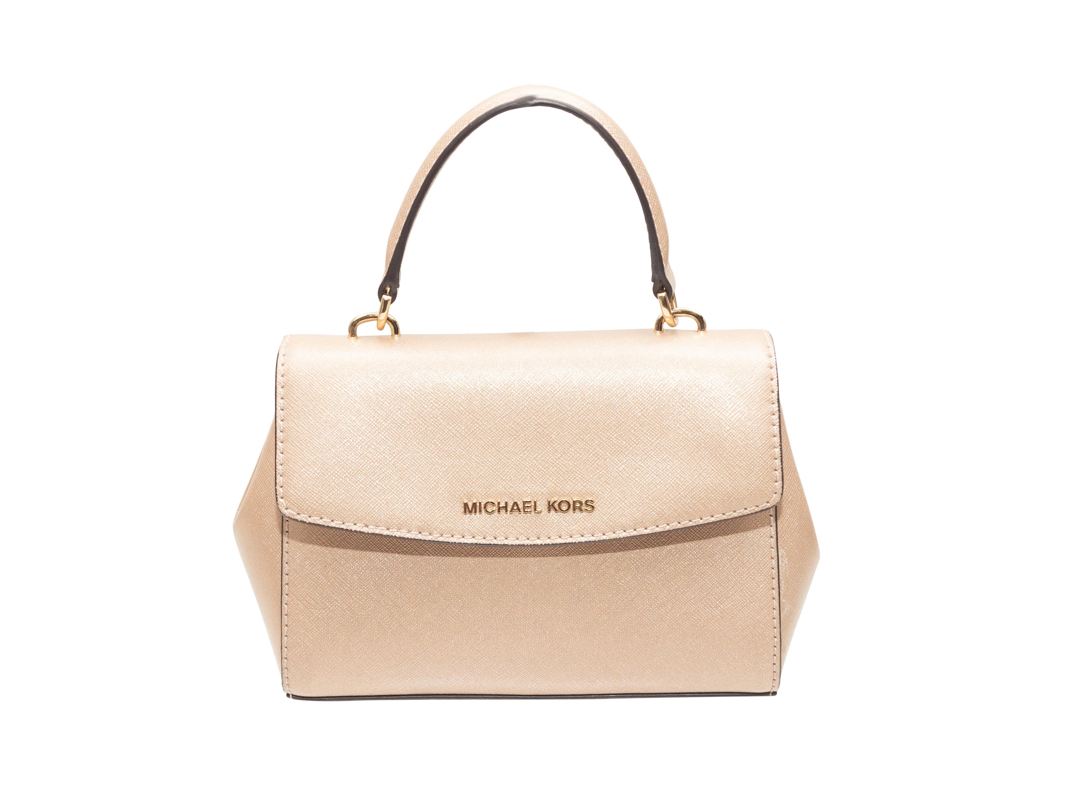 Product Details: Champagne Michael Kors Leather Mini Handbag. This handbag features a leather body, gold-tone hardware, a single top handle, an optional shoulder strap, and front flap closure. 7