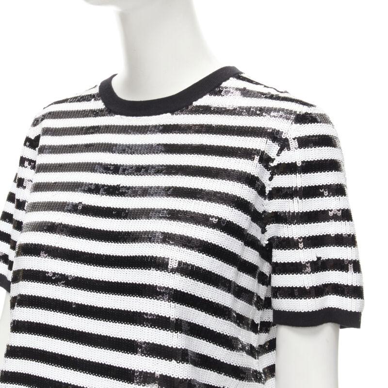 MICHAEL KORS COLLECTION 100% merino wool black white sequins striped boxy top XS
Reference: LNKO/A02036
Brand: Michael Kors
Material: Merino Wool
Color: Black, White
Pattern: Striped
Closure: Pullover
Lining:  Wool
Made in: