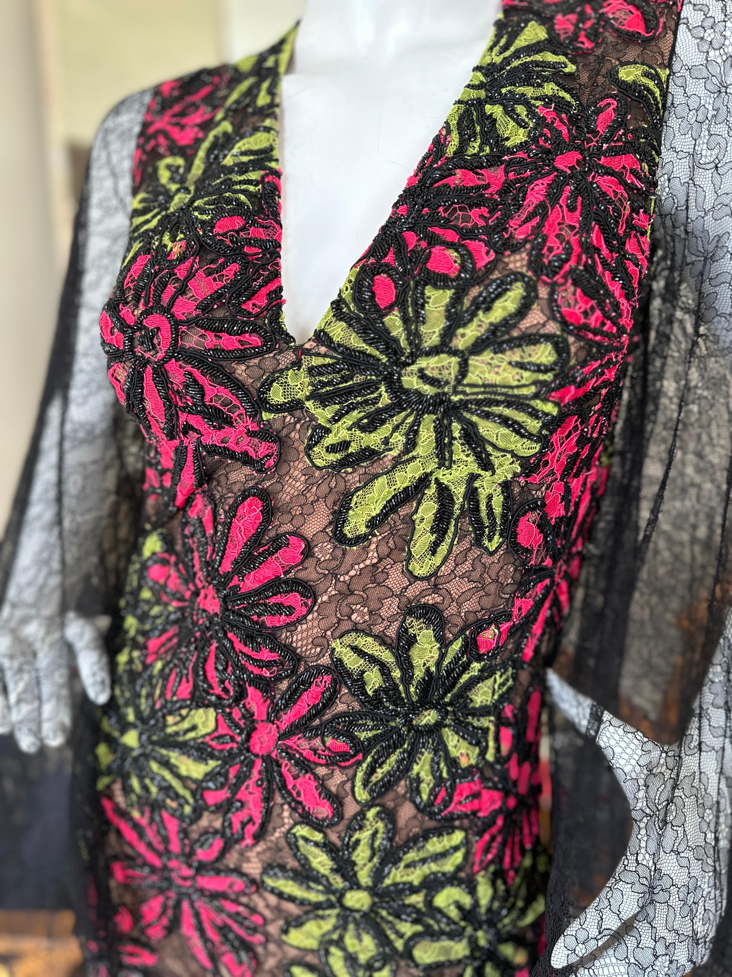 Michael Kors Collection Heavily Beaded Floral Dress with Sheer Lace Bell Sleeves
Size 2, It's too small for my mannequin, it zips all the way up
Bust 32