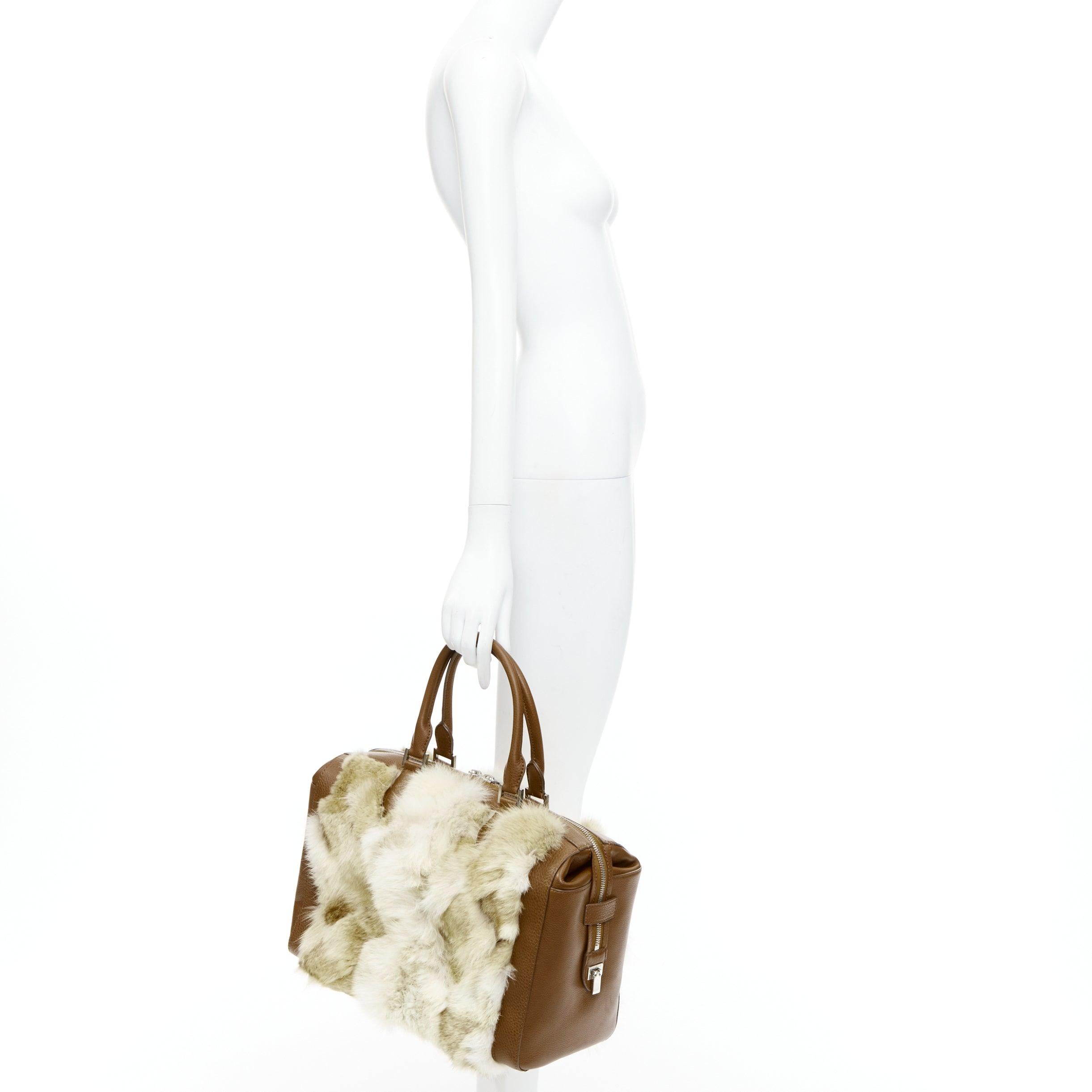 MICHAEL KORS COLLECTION brown leather cream coyote fur duffel tote bag
Reference: JHDN/A00005
Brand: Michael Kors
Designer: Michael Kors
Collection: Collection
Material: Fur, Leather
Color: Brown, Cream
Pattern: Solid
Closure: Zip
Lining: Grey