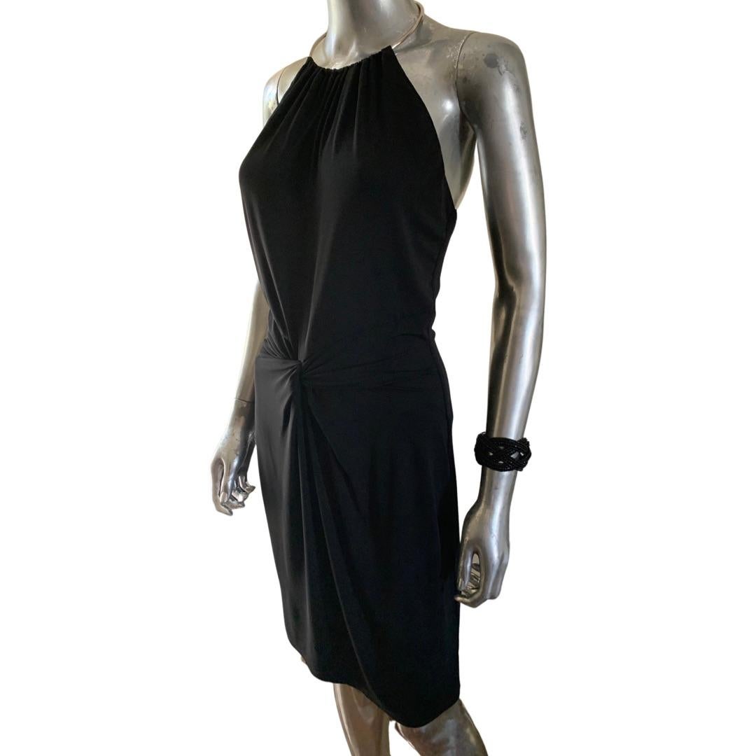 Another draped jersey beauty from Michael Kors Collection. This Runway Dress is European jersey Made in Italy. The hip draping on this dress is stunning as it starts from the neck with a chrome metal jewelry neck piece. Size and fabric tag removed,