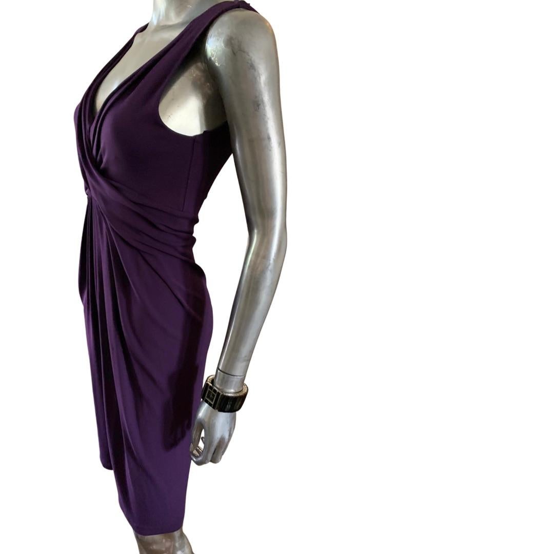 Michael Kors did the most amazing pieces in his high-end collection that were all made in Italy. The draping on this halter dress is spectacular. Done in a heavy Italian Matt jersey and a beautiful shade of plum purple. Fabric is a rayon spandex