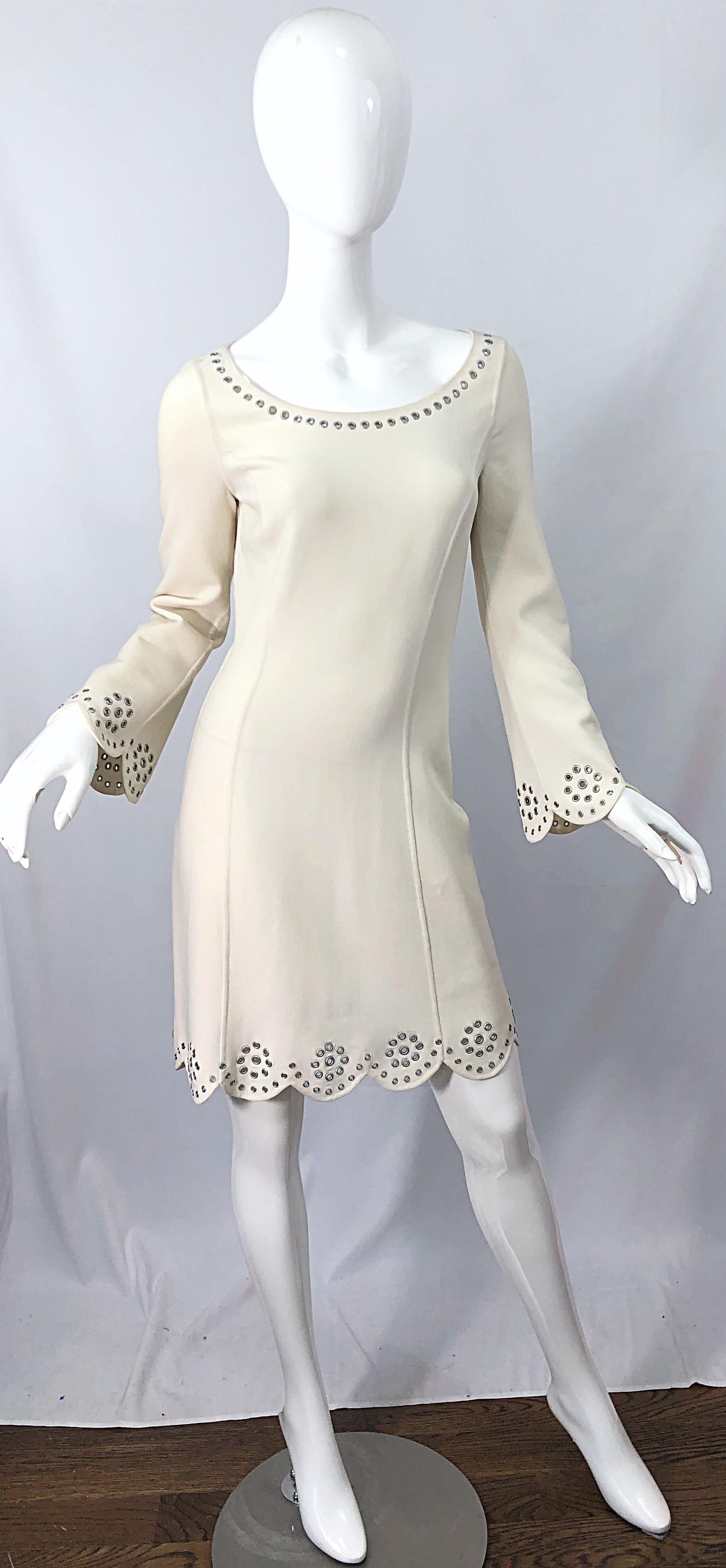 Early 2000s vintage MICHAEL KORS COLLECTION off-white / ivory long bell sleeve grommet dress ! Features a tailored bodice with silver grommets around the neck, scalloped hem, and scalloped bell sleeves. Hidden zipper up the side with hook-and-eye