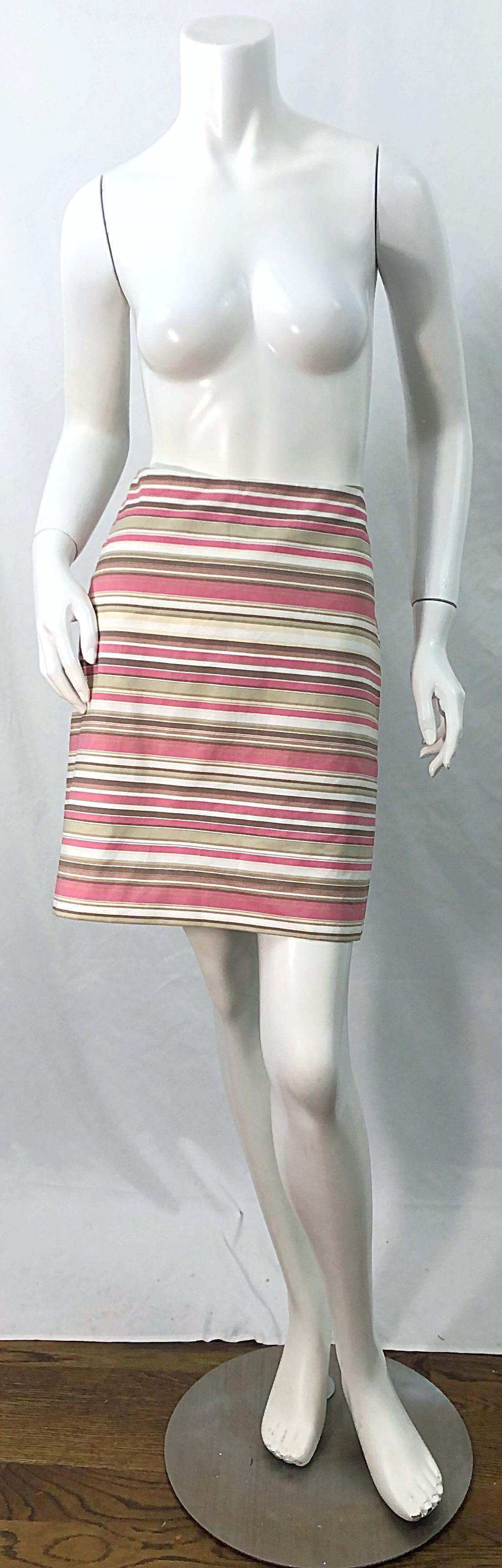 Chic early 2000s MICHAEL KORS COLLECTION Size 12 striped cotton skirt ! Features pretty colors of pink, brown, tan and white throughout. Hidden zipper up the side with hook-and-eye closure. The perfect skirt for spring and summer ! 
In great unworn