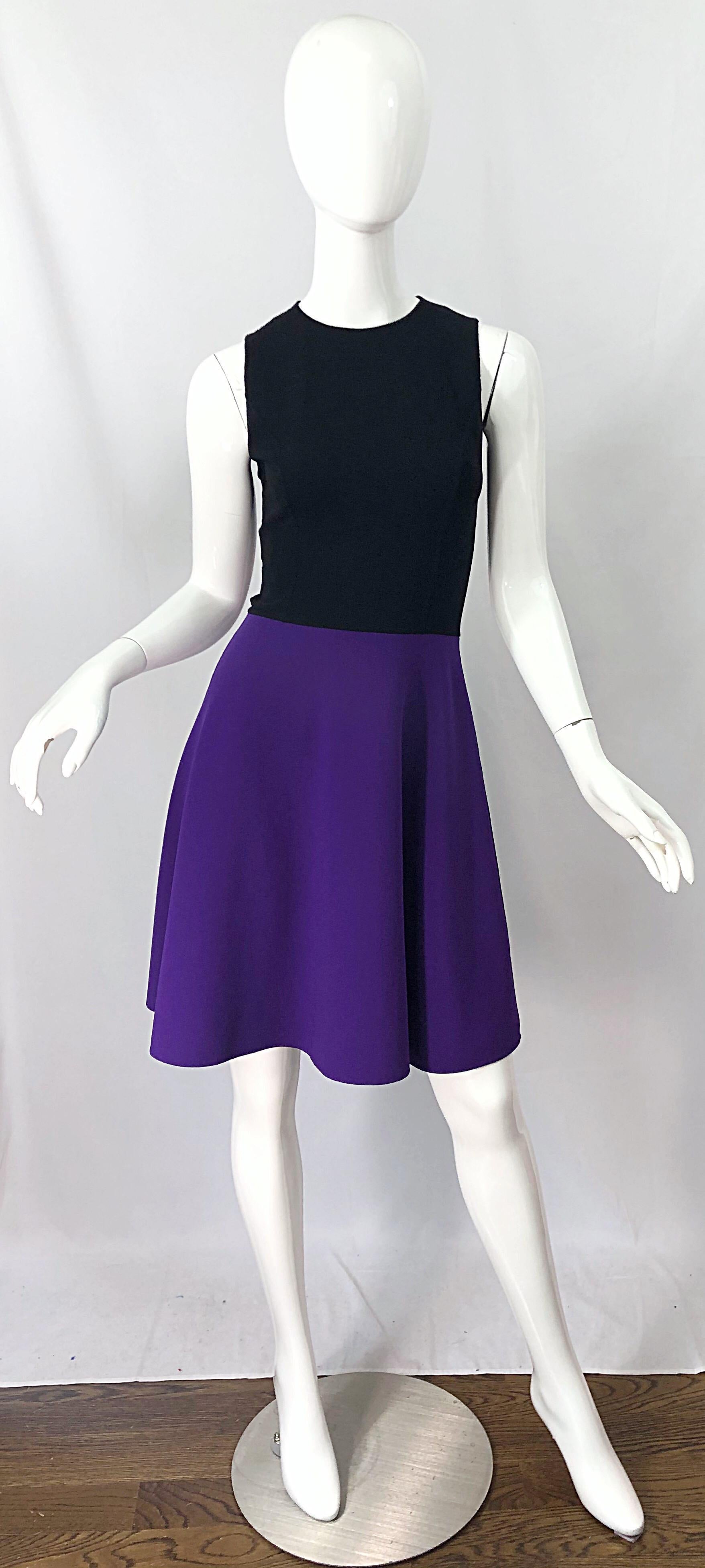Wonderful mid 2000s $1,850 MICHAEL KORS COLLECTION black and purple color block sleeveless A -Line / Skater dress! Features a tailored bodice with a full skirt. Hidden zipper up the back with hook-and-eye closure. Can easily work for day or evening