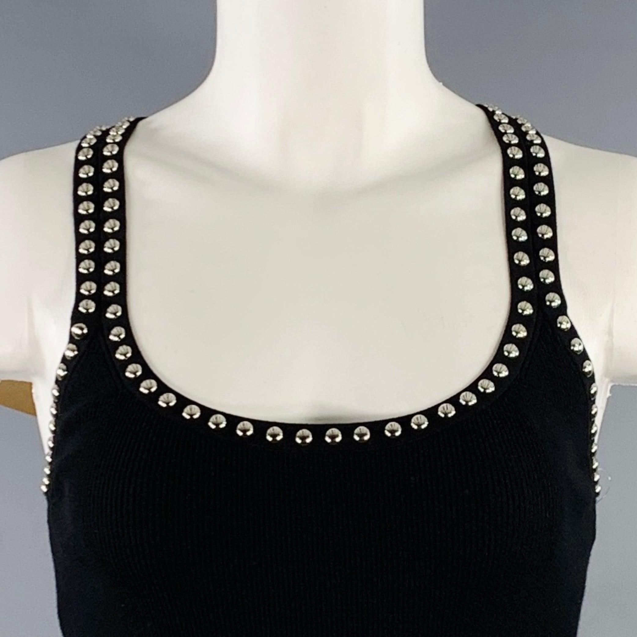 MICHAEL KORS COLLECTION casual top
in a black viscose blend jersey featuring a rib knit design, silver tone metal studded trim, and scoop neck.New with Tags. 

Marked:   S 

Measurements: 
 
Shoulder: 9 inches Bust: 24 - 32 inches Length: 21.5