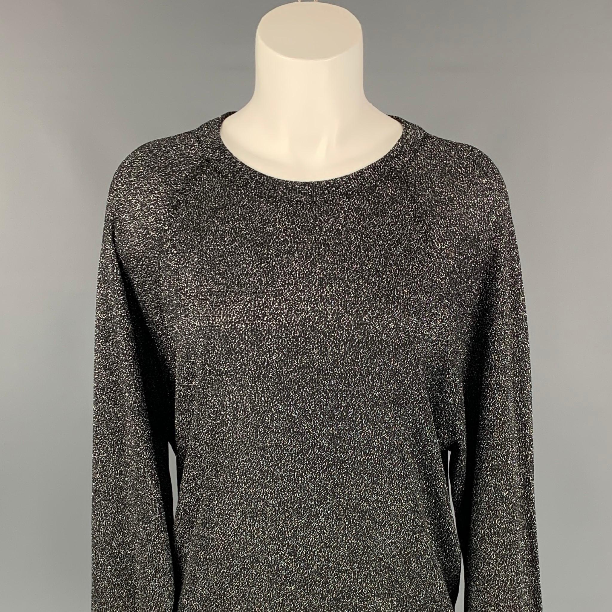 MICHAEL KORS COLLECTION pullover comes in a black & silver metallic acetate blend featuring a loose fit and a crew-neck. 

Very Good Pre-Owned Condition.
Marked: XS

Measurements:

Shoulder: 16 in.
Bust: 40 in.
Sleeve: 26 in.
Length: 26 in. 
