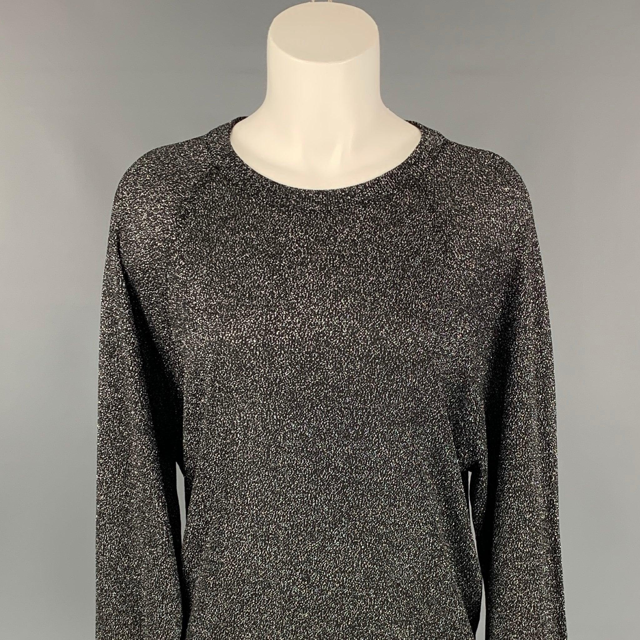 MICHAEL KORS COLLECTION pullover comes in a black & silver metallic acetate blend featuring a loose fit and a crew-neck.
Very Good
Pre-Owned Condition. 

Marked:   XS 

Measurements: 
 
Shoulder: 16 inches  Bust: 40 inches  Sleeve: 26 inches 