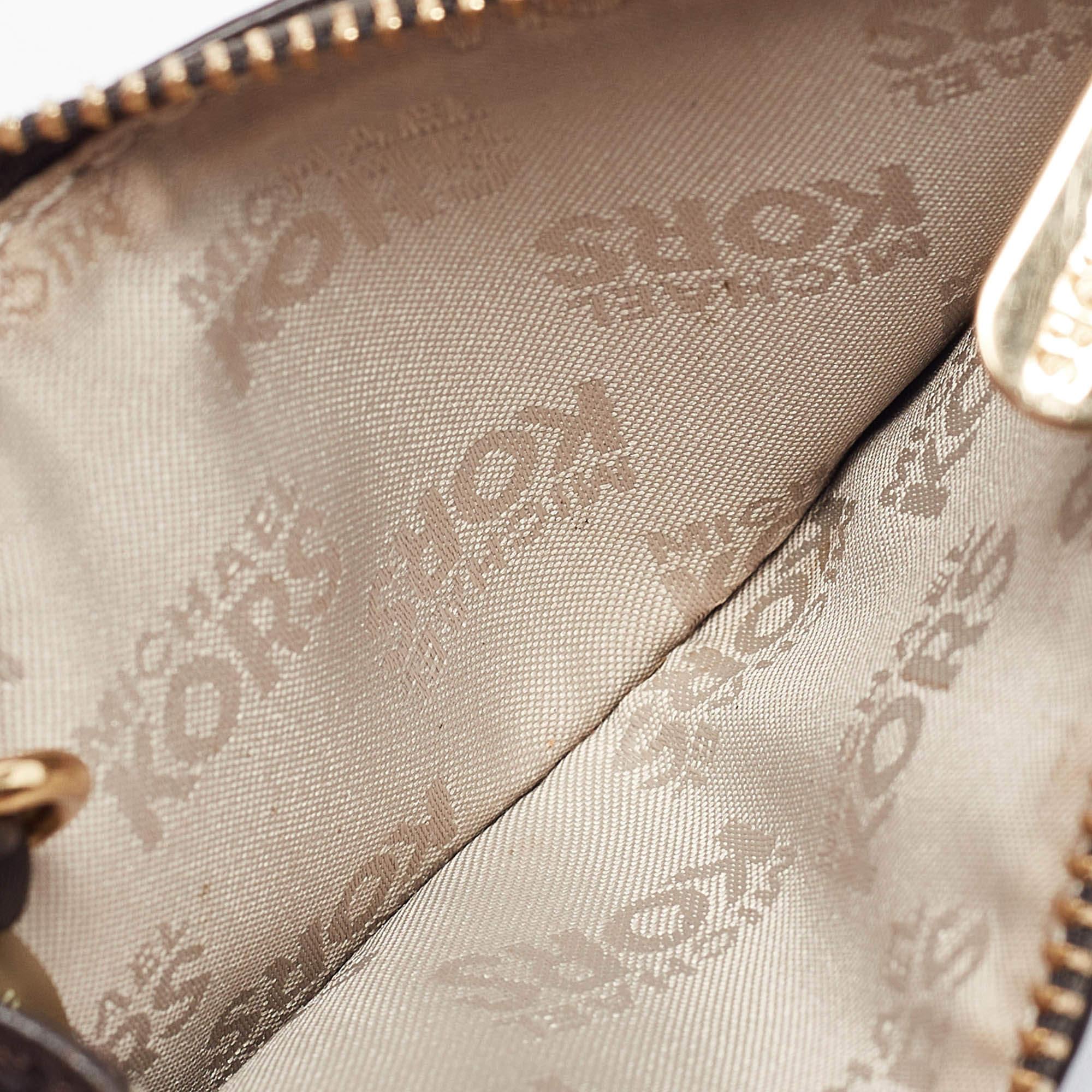 This designer coin purse is practical and sophisticated in design. Created from luxe materials its interior will keep your coins in order.