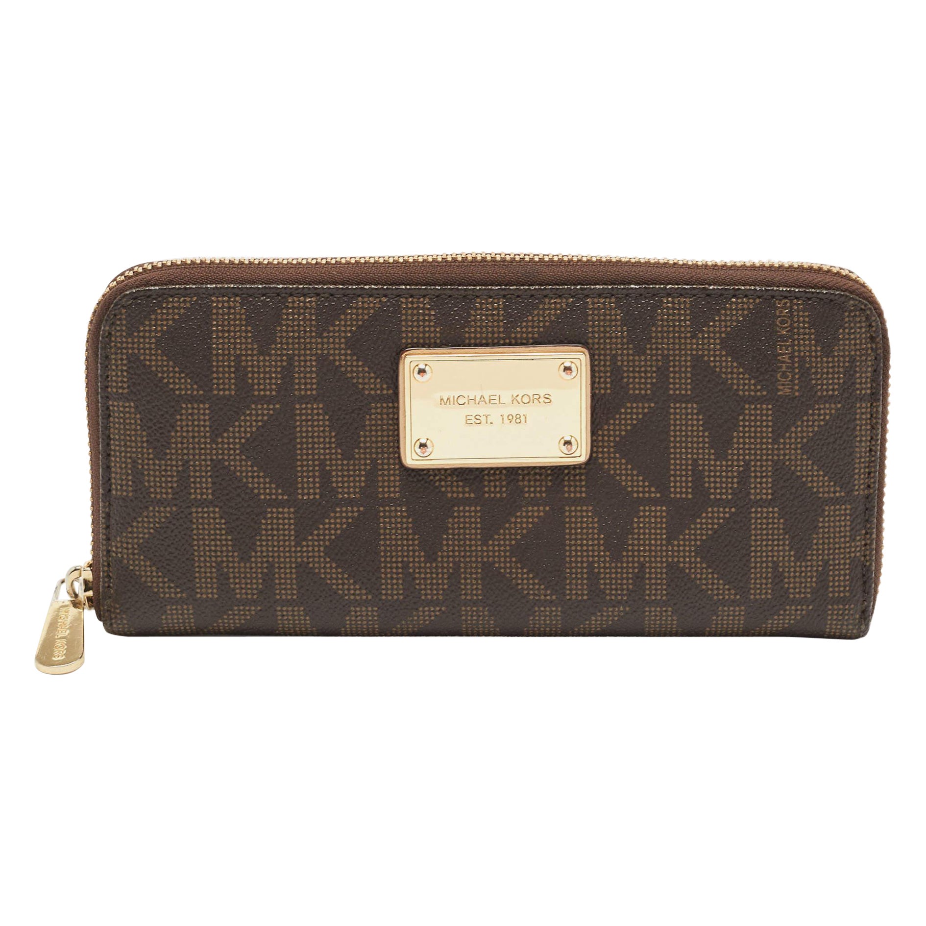 Michael Kors Portafoglio con zip in tela rivestita Monogram marrone scuro