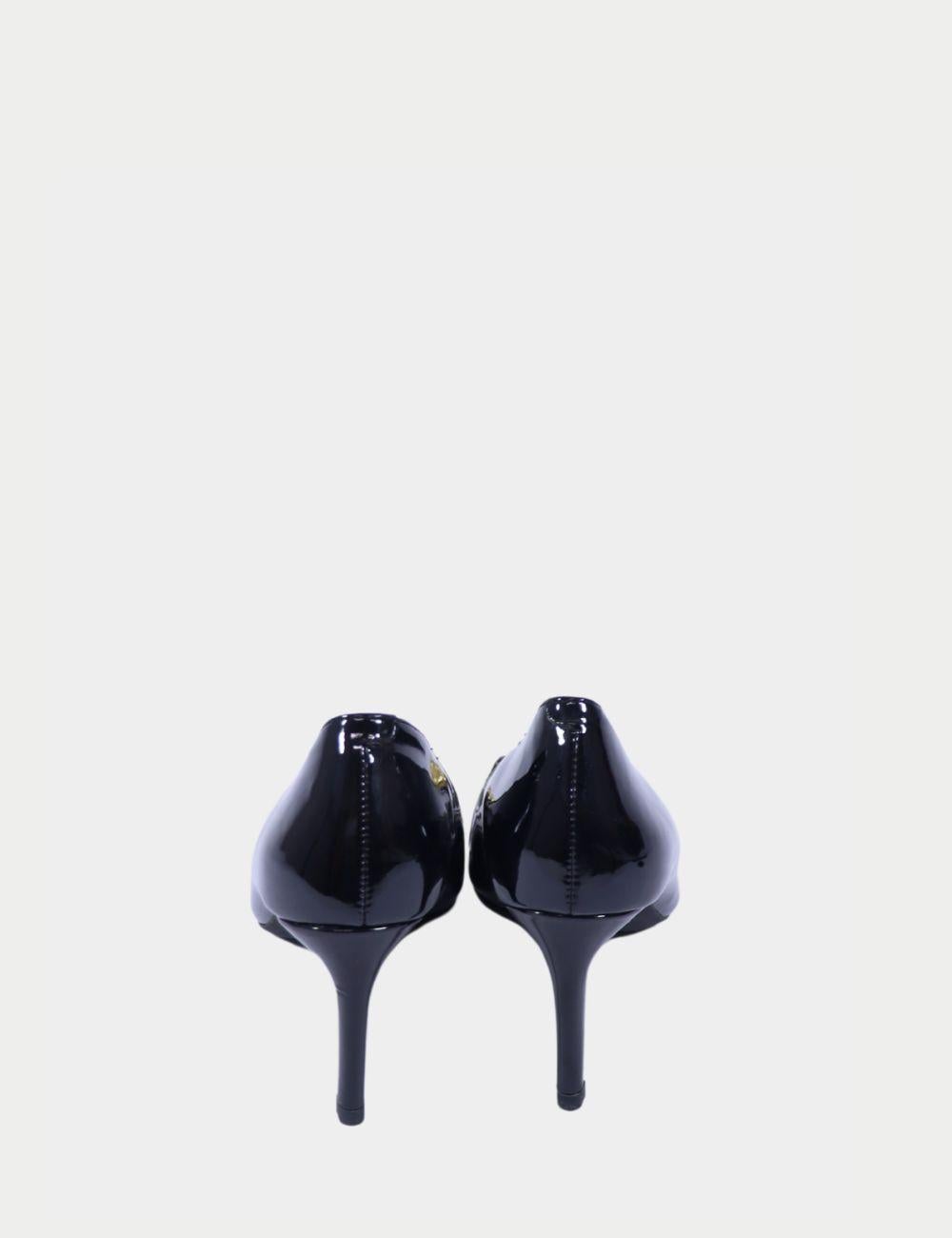 Michael Kors Black Patent Leather Logo Heels

Make an unforgettable impression with these sleek black patent leather heels by Michael Kors. Featuring a glossy finish, pointed toe, and iconic MK logo buckle in gold-tone hardware, these pumps bring a