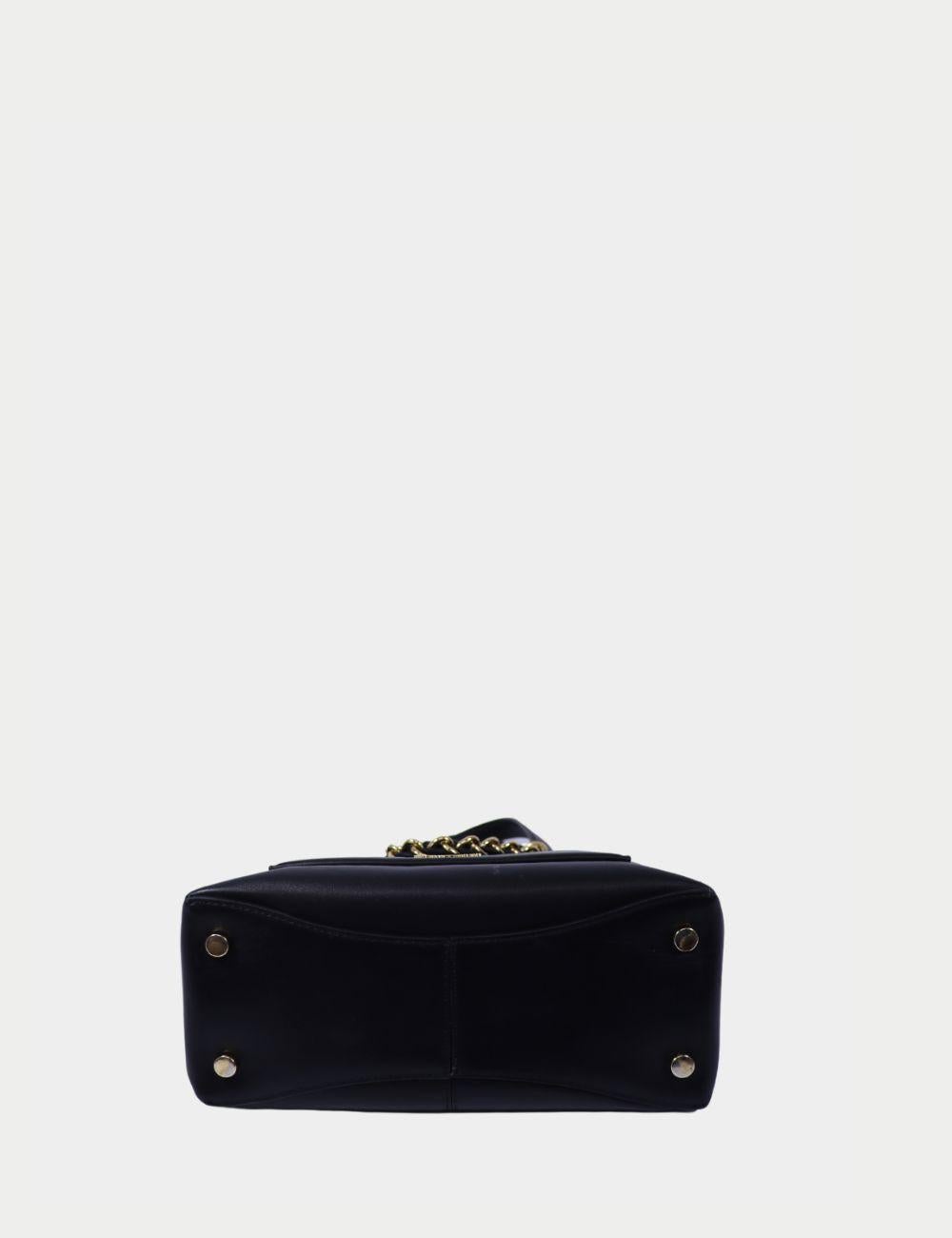 Michael Kors Black Leather Chain Handle Tote

Step out in timeless sophistication with this Michael Kors black leather tote. Crafted from supple, high-quality leather, this structured handbag features dual top handles and a striking gold-tone chain