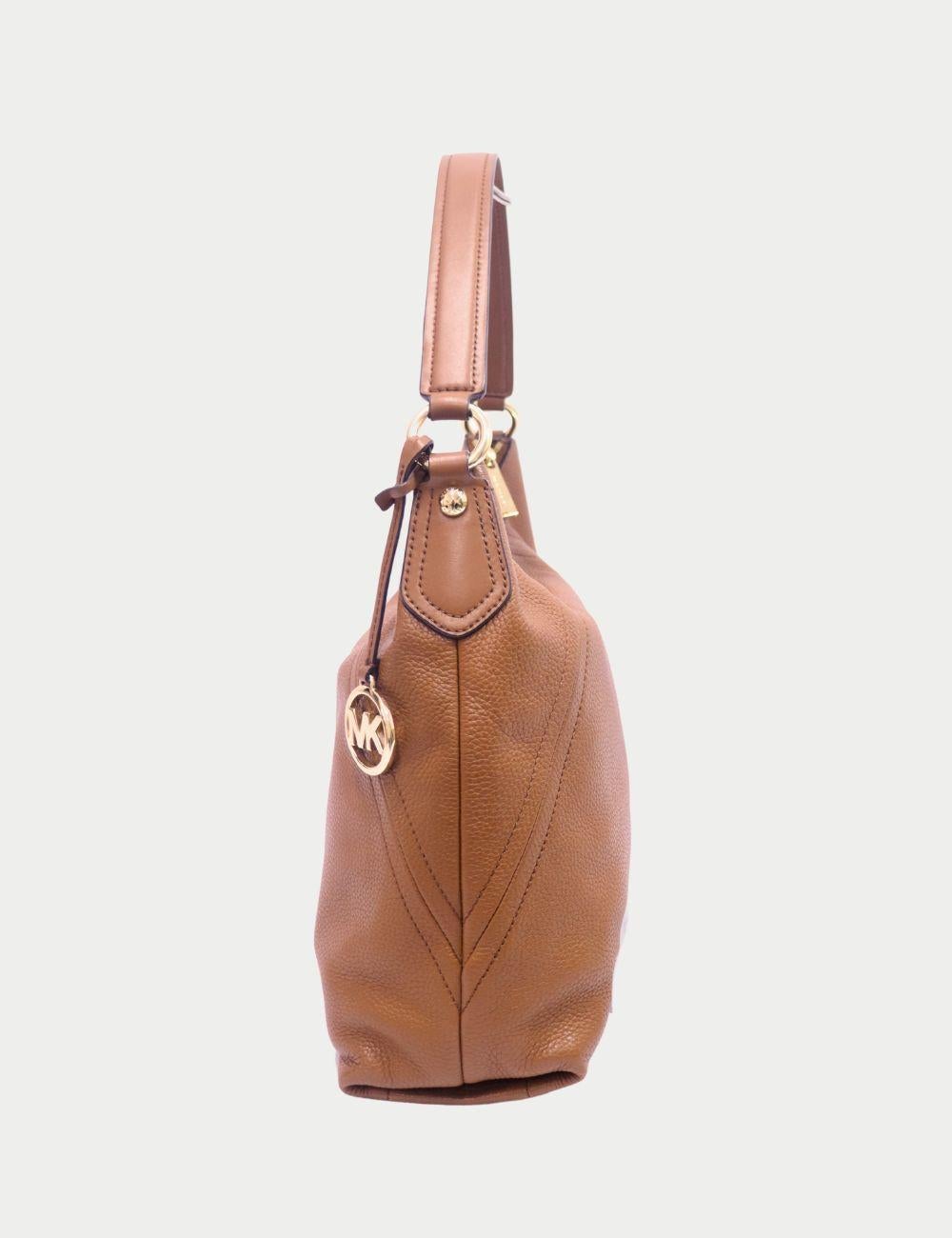 Michael Kors Camel Pebbled Leather Hobo Bag with Gold Hardware

Sleek, soft, and stylish—this Michael Kors hobo bag in rich camel pebbled leather is the perfect blend of everyday luxury and practicality. Designed with a minimalist silhouette, it