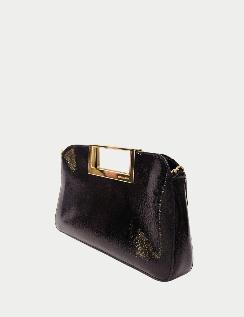 Michael Kors Black & Silver Shimmer Clutch with Gold Handle


Add a touch of glamour to your evening look with this Michael Kors Black & Silver Shimmer Clutch, designed to make a statement. Crafted with a sleek black and silver textured shimmer