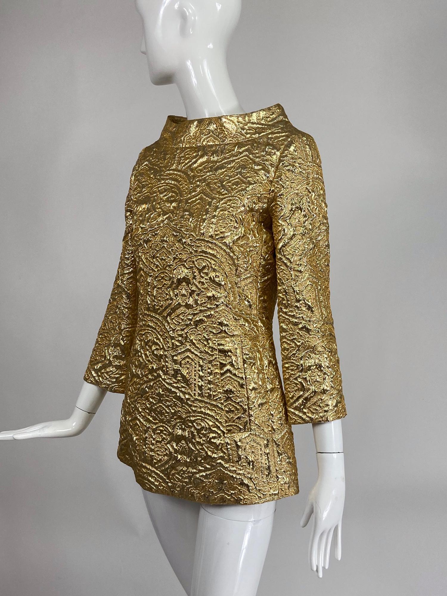 Michael Kors gold metallic brocade tunic top. Michael Kors take on a 60s favourite, stand away neckline tunic with bracelet length sleeves and a fitted A line shape, hip front faux pockets. Perfect to pair with fitted trousers or skirts mini or