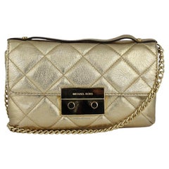 Used Michael Kors Gold Quilted Bag with 7 Slide Pockets