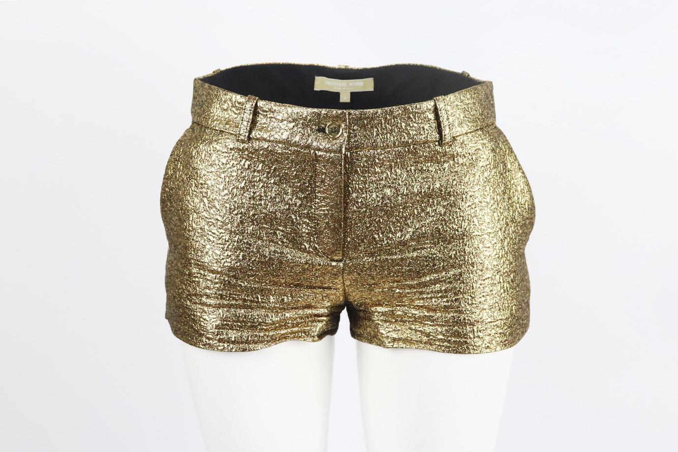 Michael Kors metallic jacquard shorts. Gold. Button and zip fastening at front. 45% Wool, 37% acetate, 18% polyester; lining: 100% cotton. Size: US 4 (UK 8, FR 36, IT 40). Waist: 29 in. Hips: 38 in. Length: 9.5 in. Inseam: 1.6 in. Rise: 9 in
