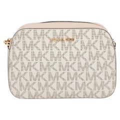 Michael Kors Bolso cruzado Jet Set de piel recubierta de lona rosa/beige Signature