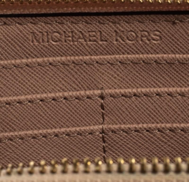 Women's Michael Kors Pink Signature Leather Zip Around Wallet For Sale