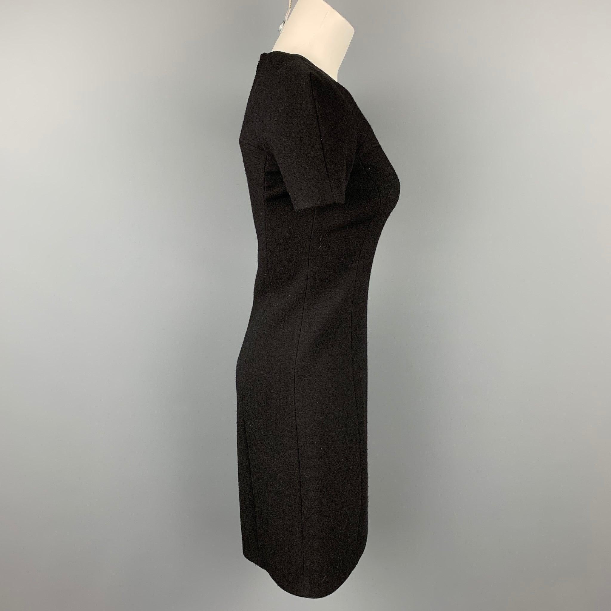 MICHAEL KORS dress comes in a black crepe with a slip liner featuring a shift style and a back zip up closure. Moderate wear. Made in Italy.Very Good
Pre-Owned Condition. 

Marked:   0 

Measurements: 
 
Shoulder: 17 inches  Bust: 30 inches  Waist: