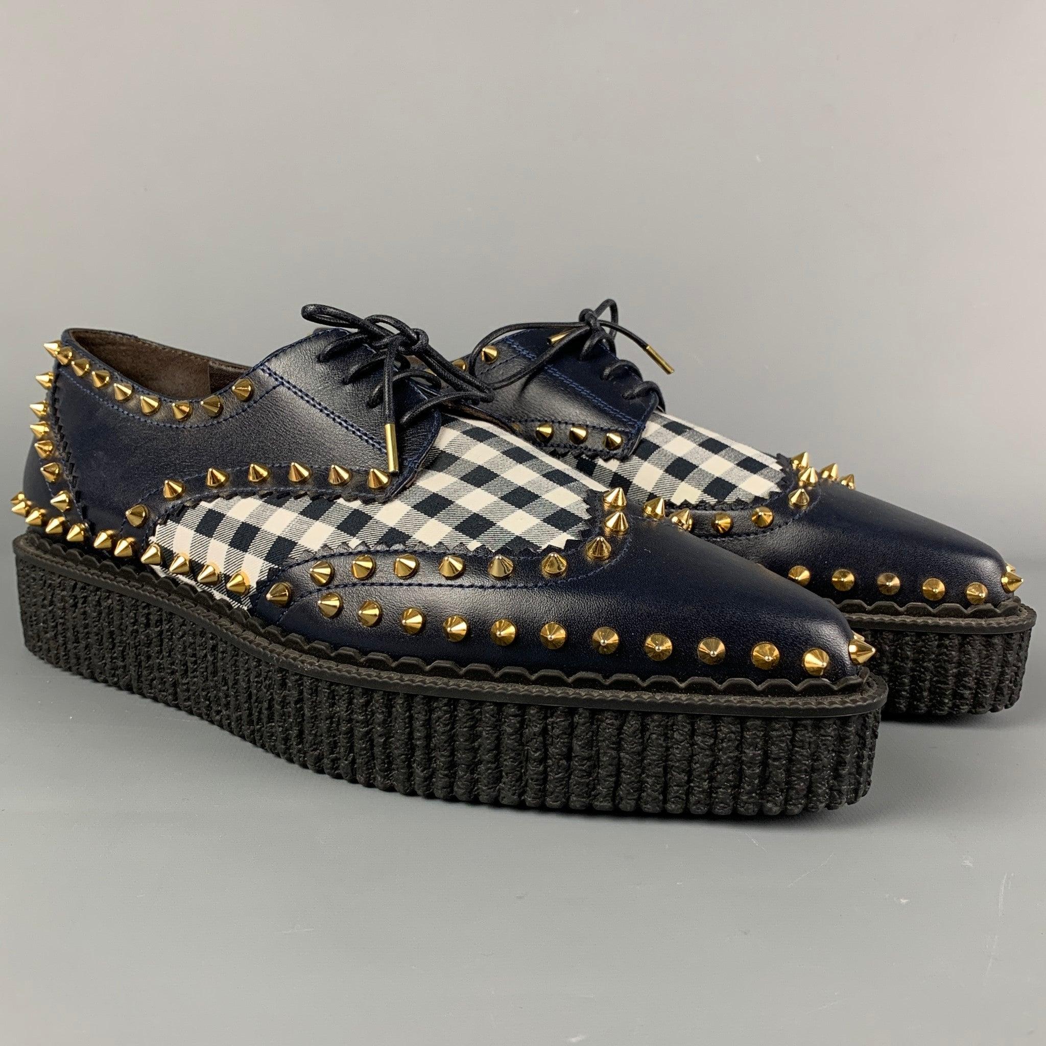 MICHAEL KORS shoes comes in a navy & white leather featuring a pointed toe, gold tone studs, platform sole, and a lace up closure. Made in Italy.
Excellent
Pre-Owned Condition. 

Marked:   41Length: 11.5 inches  Width: 3.75 inches  Platform: 1.25