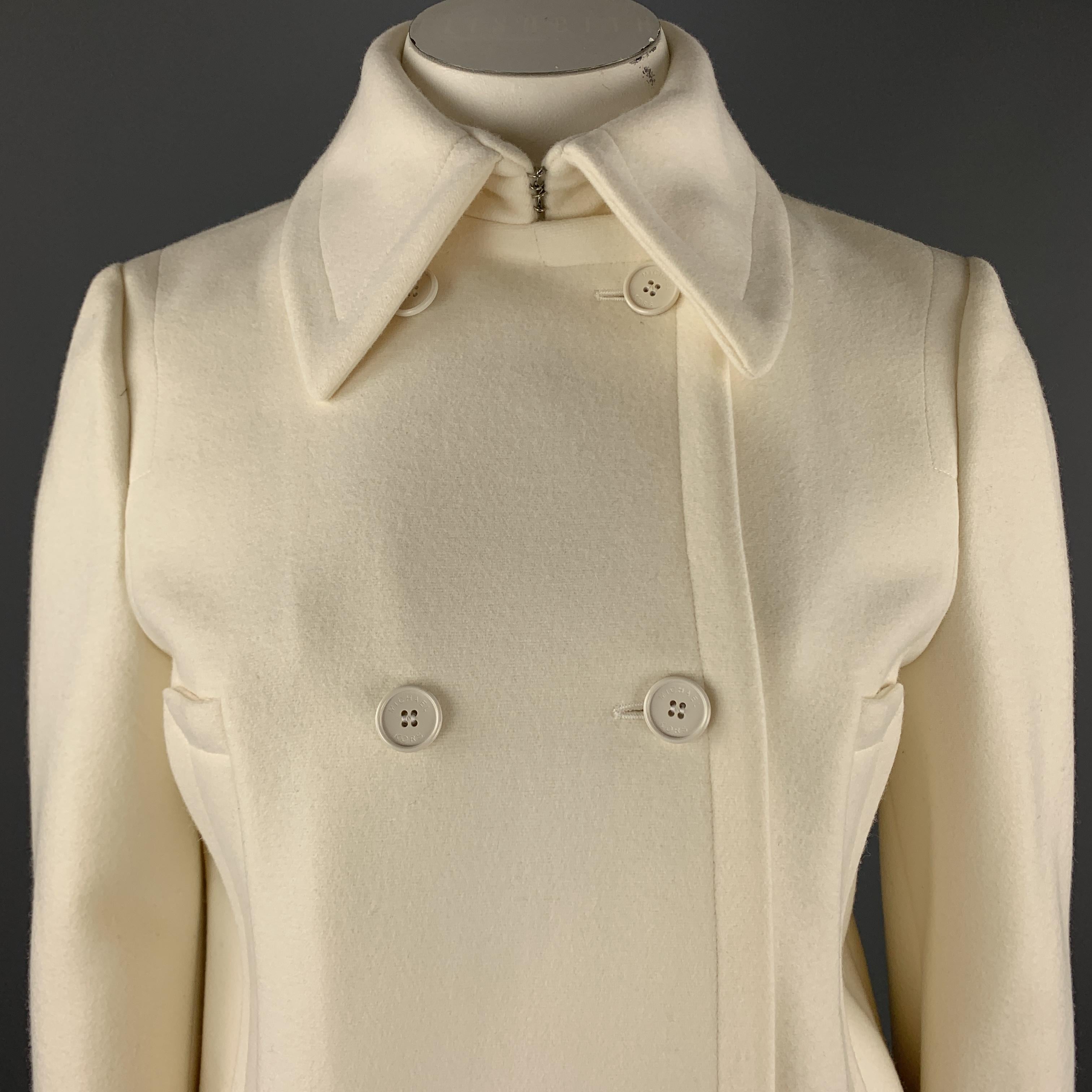 MICHAEL KORS cropped peacoat comes in cream wool with a pointed collar, double breasted button up front, and mock pockets. Made in Italy.

New with Tags.
Marked: US 12

Measurements:

Shoulder: 16 in.
Bust: 42 in.
Sleeve: 26 in.
Length: 21 in.