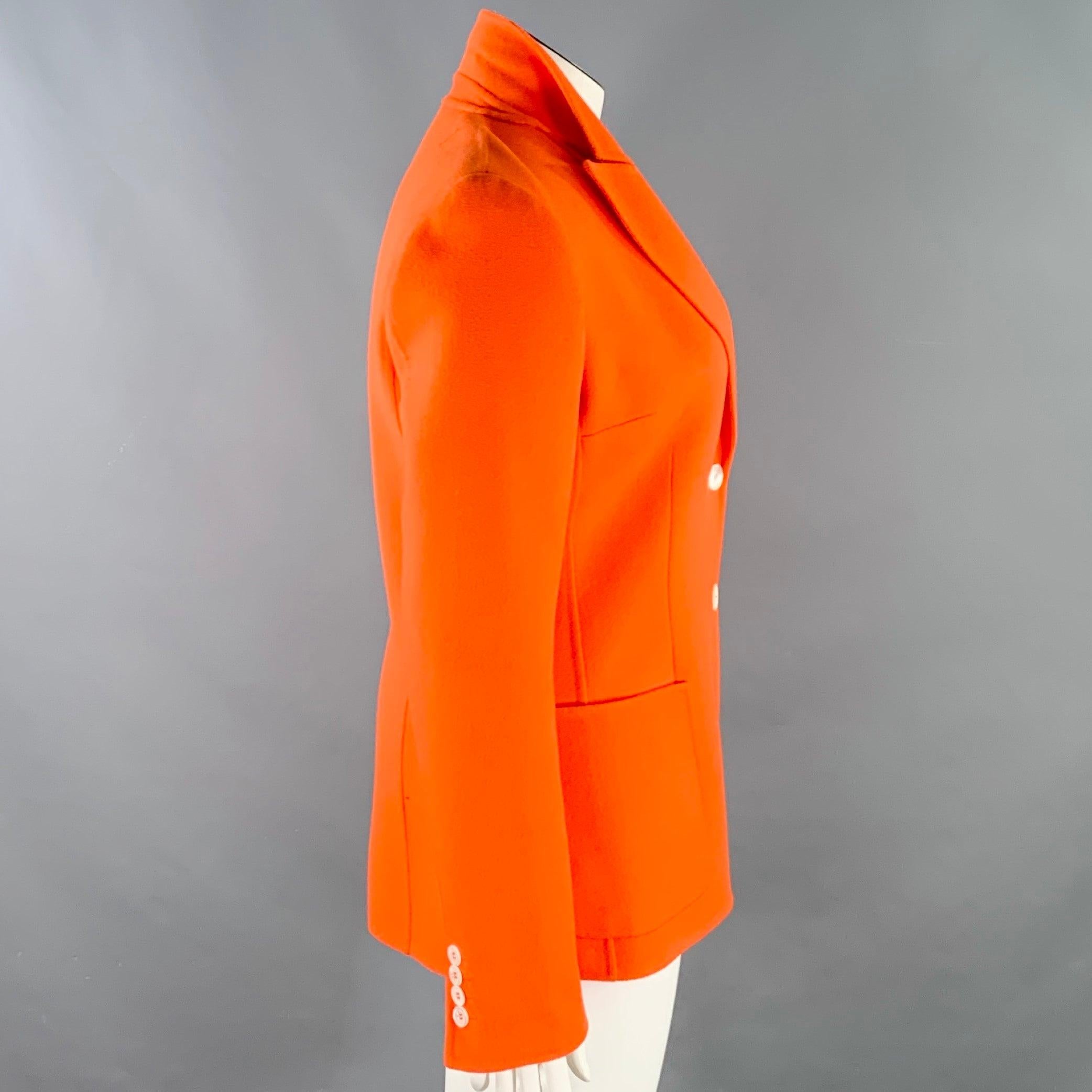 MICHAEL KORS coat
in an orange wool cashmere featuring a peak lapel, ventless back, and double button closure. Made in Italy.Very Good Pre-Owned Condition. Minor marks on inside of coat at lapel. 

Marked:   12 

Measurements: 
 
Shoulder: 1.5
