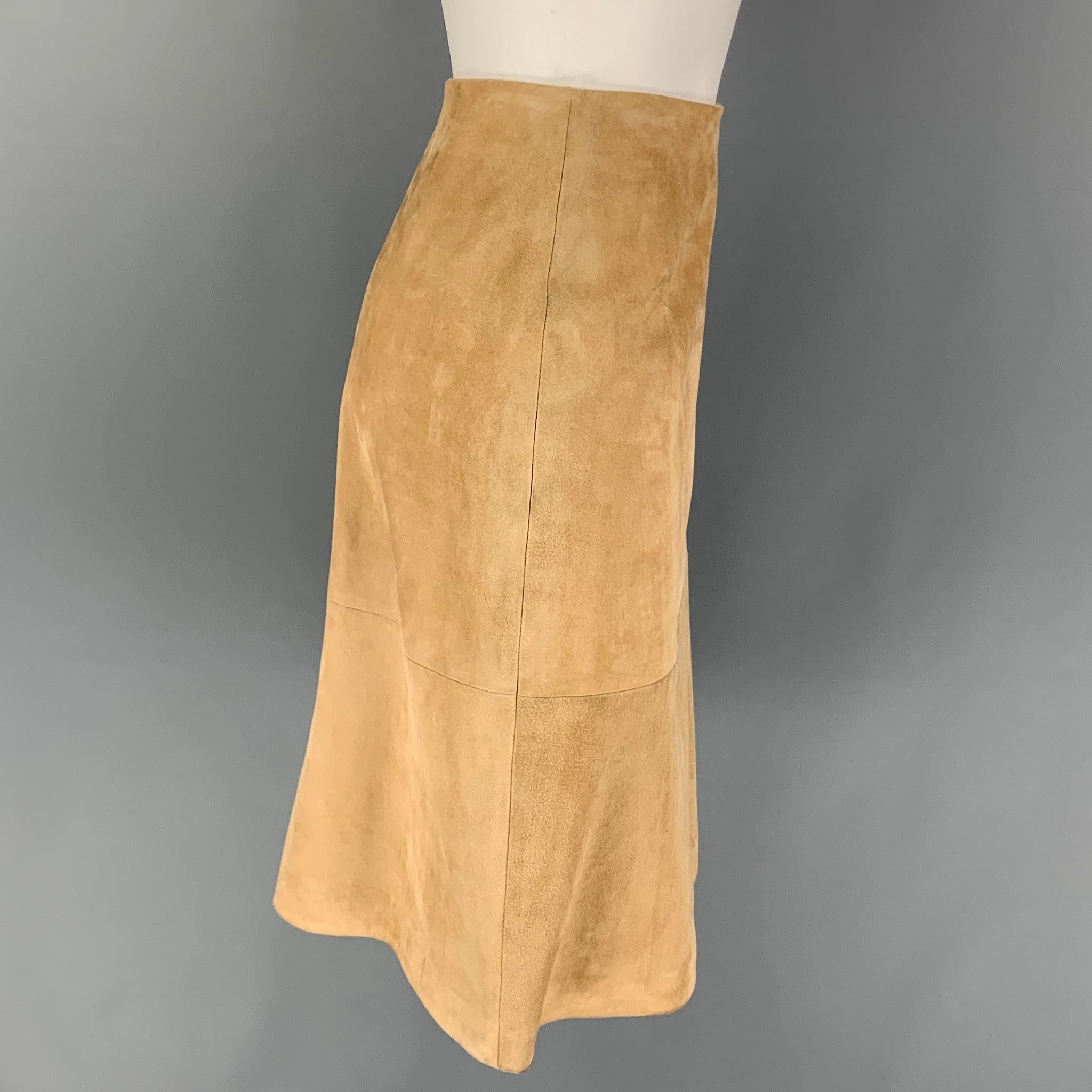 MICHAEL KORS skirt comes in a beige suede with a silk liner featuring 
pencil style and a side zipper closure. Made in Italy. Very Good
Pre-Owned Condition. 

Marked:   2 

Measurements: 
  Waist: 26 inches  Hip: 34 inches  Length: 24.5 inches 
  
 