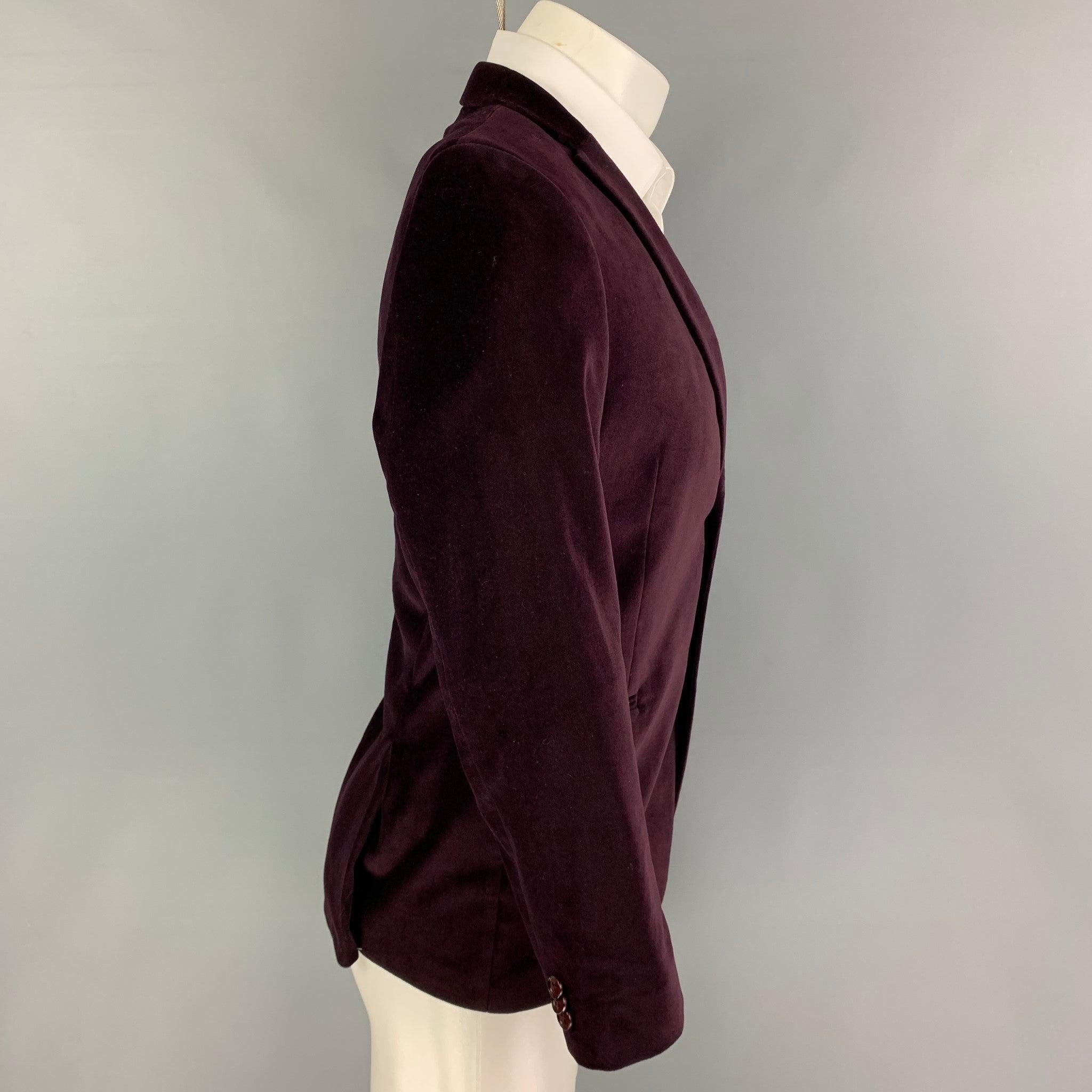 MICHAEL KORS sport coat comes in a purple velvet cotton with a full liner featuring a notch lapel, slit pockets, double back vent, and a double button closure.
Excellent
Pre-Owned Condition. 

Marked:   Size tag removed.  

Measurements: 
