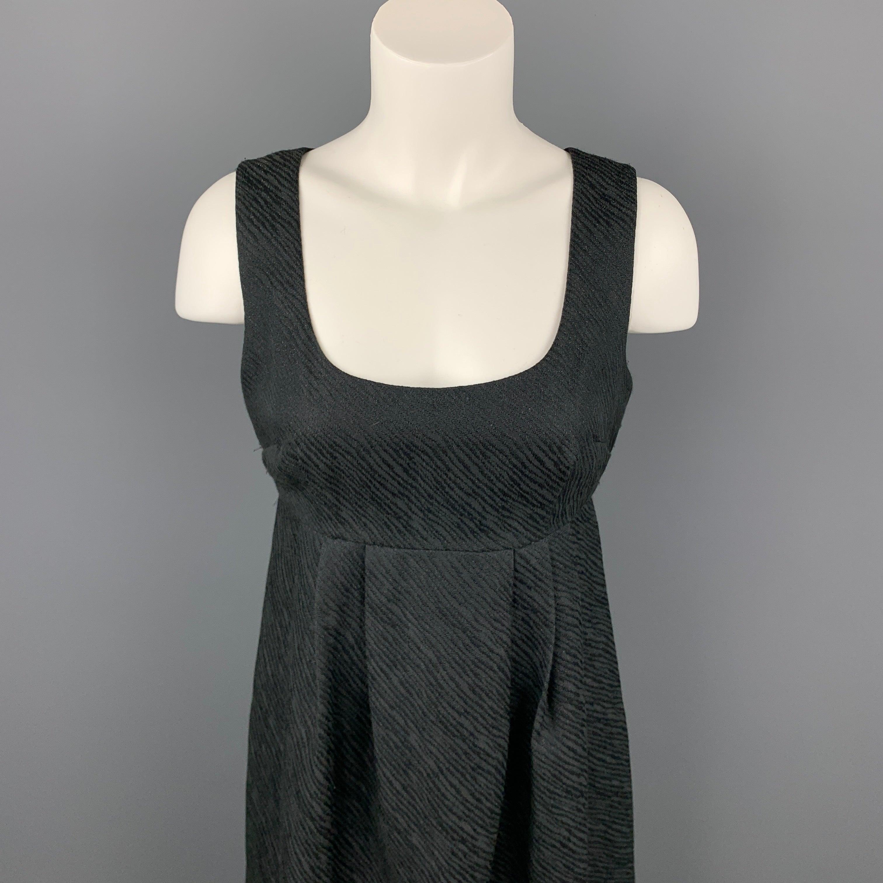 MICHAEL KORS dress comes in a black woven polyester blend with metallic thread details featuring a empire waist and a back zip up closure.
Good
Pre-Owned Condition. 

Marked:  4 

Measurements: 
 
Shoulder: 13 inches 
Bust: 32 inches 
Waist: 30
