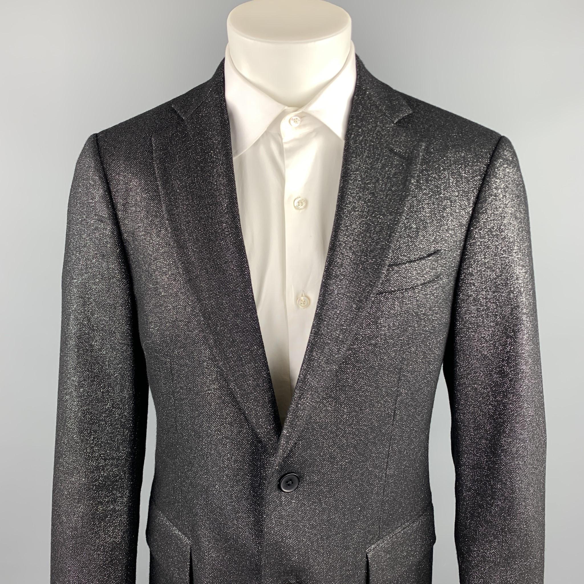 MICHAEL KORS sport coat comes in a black & silver metallic wool blend featuring a notch lapel style, flap pockets, and a two button closure. Made in Italy.

Excellent Pre-Owned Condition.
Marked: 40/50 REG

Measurements:

Shoulder: 17 in. 
Chest: 40