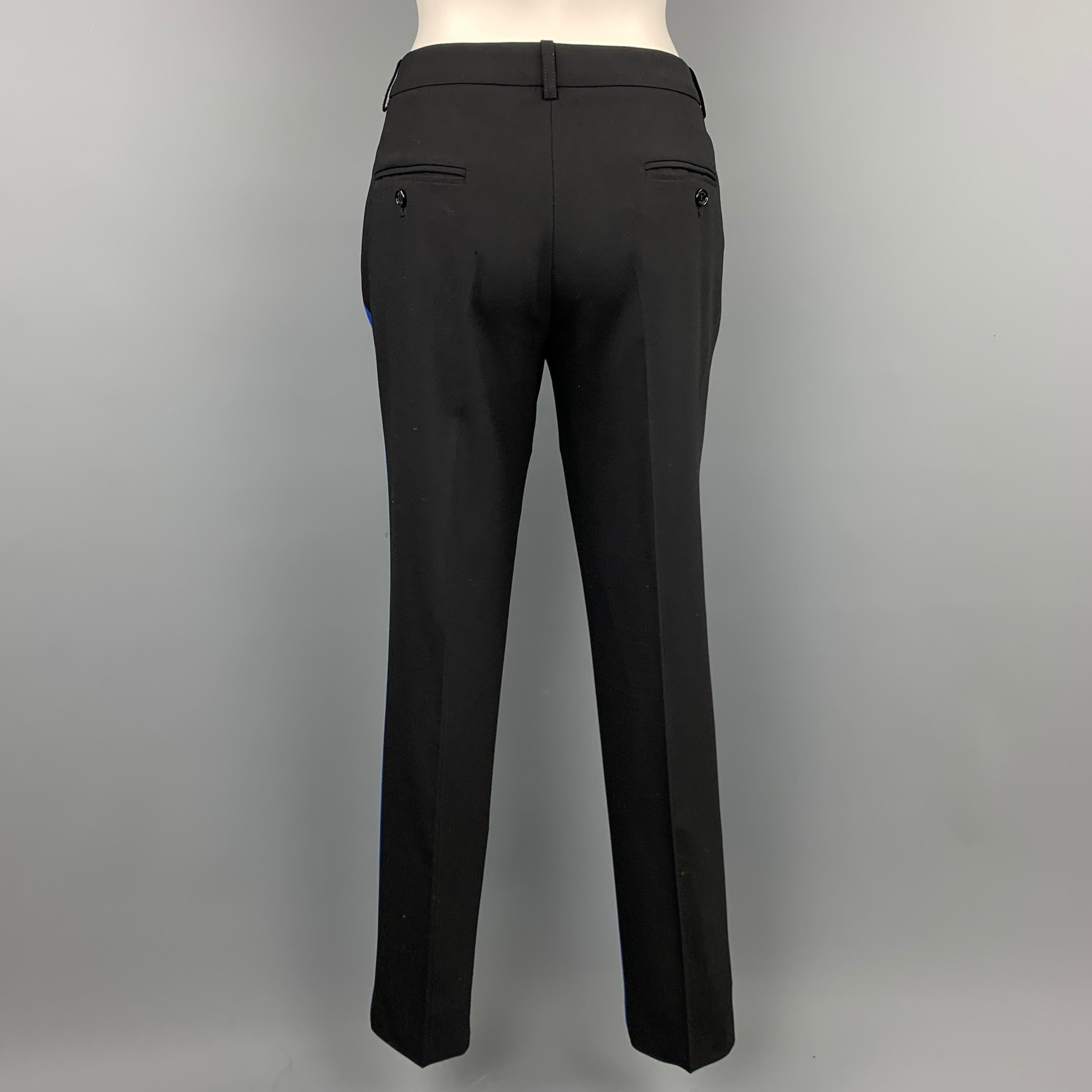 MICHAEL KORS dress pants comes in a blue & black color block cotton featuring a narrow leg, slit pockets, and a zip fly closure. Made in Italy.

Very Good Pre-Owned Condition.
Marked: 6

Measurements:

Waist: 30 in.
Rise: 9.5 in.
Inseam: 29 in.  
