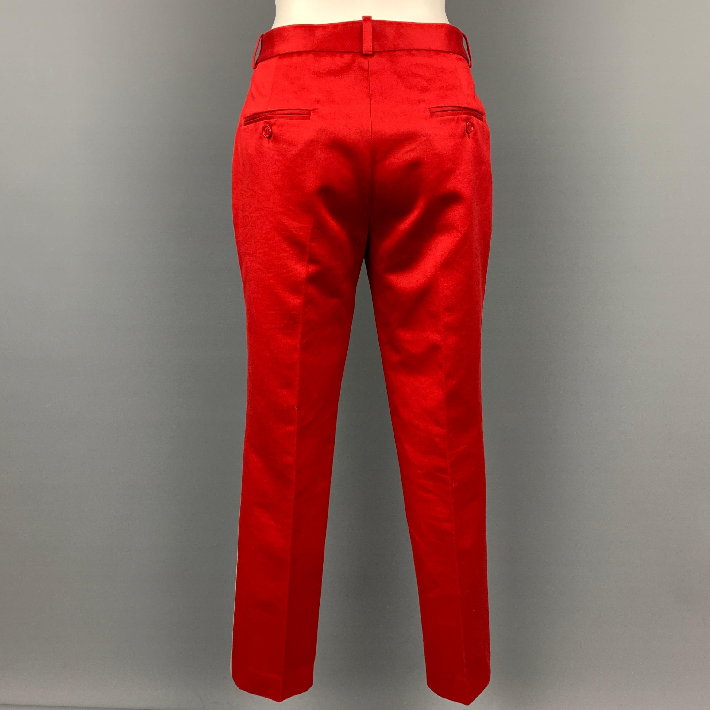 MICHAEL KORS dress pants comes in a khaki & red color block cotton featuring a narrow leg, slit pockets, and a zip fly closure. Made in Italy.

Very Good Pre-Owned Condition.
Marked: 6

Measurements:

Waist: 30 in.
Rise: 9.5 in.
Inseam: 29 in. 
